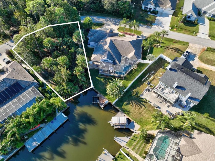 Build your “Dream Home” on one of Palm Coast's desirable saltwater canals. This beautiful lot is located in Palm Harbor close to shopping and the beach. The lot is high and dry. The seller has a ready to proceed package with drawings, structural, trusses, survey, soil test by  engineering. This is included in the sale ready for a new owner to get it permited.