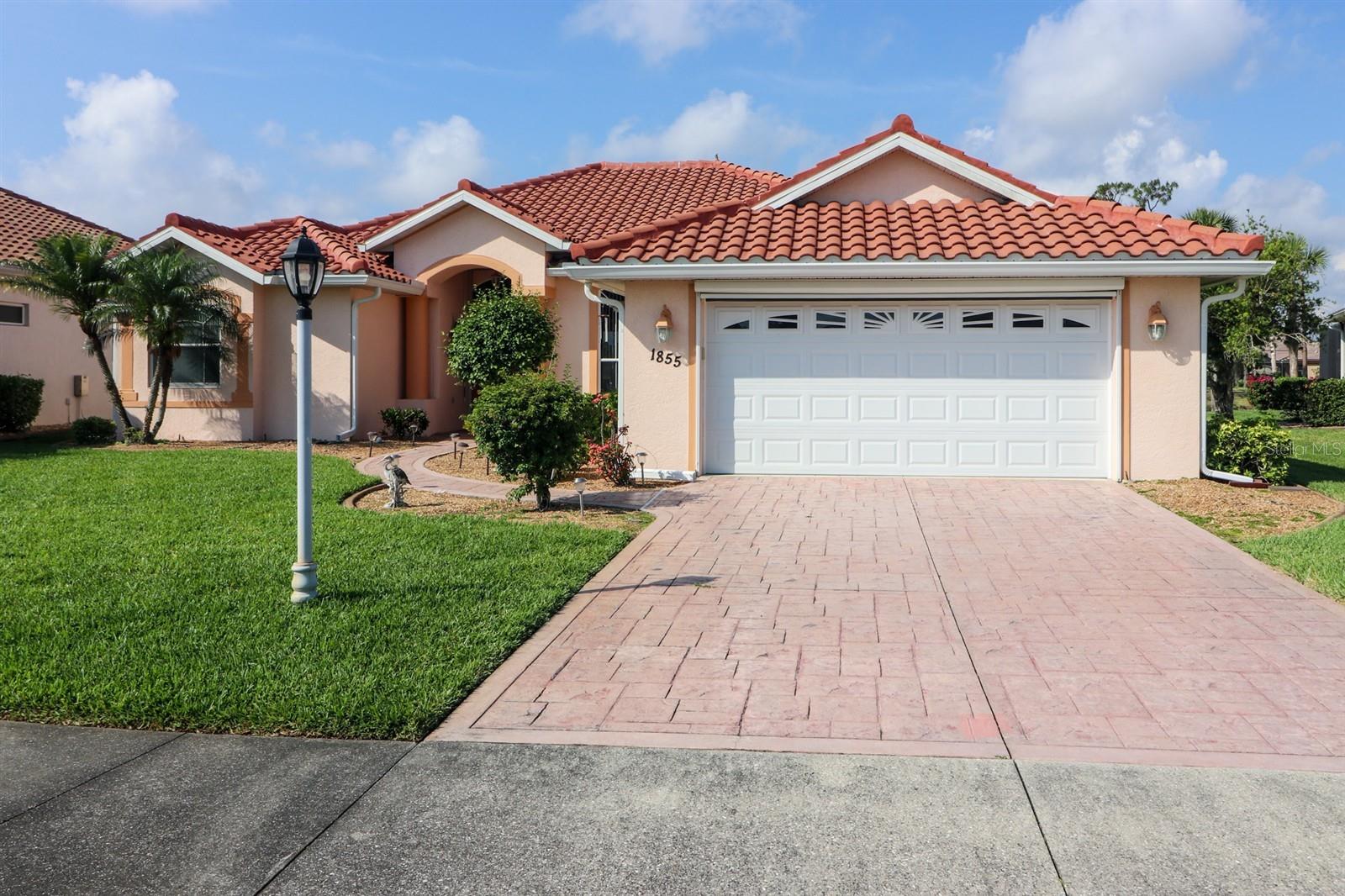 WONDERFUL LOCATION FOR THIS LARGE WATERFRONT HOME IN THE GATED COMMUNITY OF BOBCAT TRAIL! THIS HOME OFFERS SLIDERS IN THE LIVING ROOM, CORNER SLIDERS IN THE FAMILY ROOM AND A LARGE WINDOW IN THE DINETTE AREA FOR BEAUTIFUL PANORAMIC VIEWS OF THE FOUNTAIN POOL AND POND. And you can open them for a nice breeze during the cooler months. This home boasts 3 BR, 3 BA plus a den! Den can also be used as a BR. It is a spacious home with 2,442 sf of living space. The large two-car garage is neat with lots of shelves. There are large, light ceramic tile floors throughout, white cabinets, including a focal cabinet with colorful stain glass which gives a nice Floridan touch. Gorgeous high, coffered ceilings, double entrance doors and separate laundry room. Come see this luxurious home before it is gone. Bobcat trail offers a community center with activities, heated community pool, fitness room, tennis and more. It is close to US41 and a short drive to I75. There is plenty of shopping and restaurants to experience and it is a short drive to the SWFL beaches.