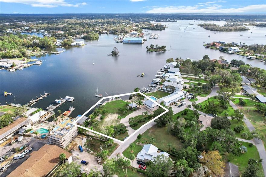 Spectacular Waterfront Estate with 310' on the Crystal River with .93 acres! A clear, blue spring close to the seawall! Truly one of a kind! 2 homes, a cook house, pool, dock, seawall. Not another parcel in all of the Crystal River Waterfront like this one!