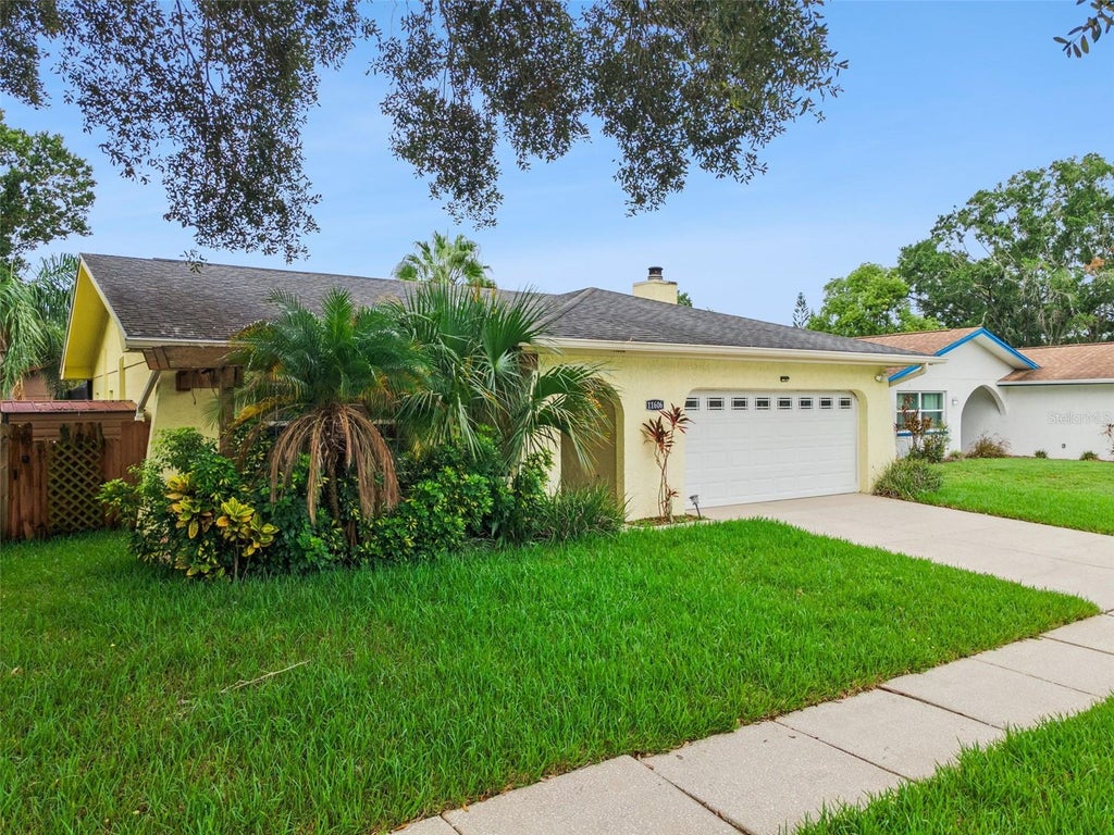 Photo of 11606 Painted Hills Lane, Tampa, FL 33624 (MLS # O6431117)