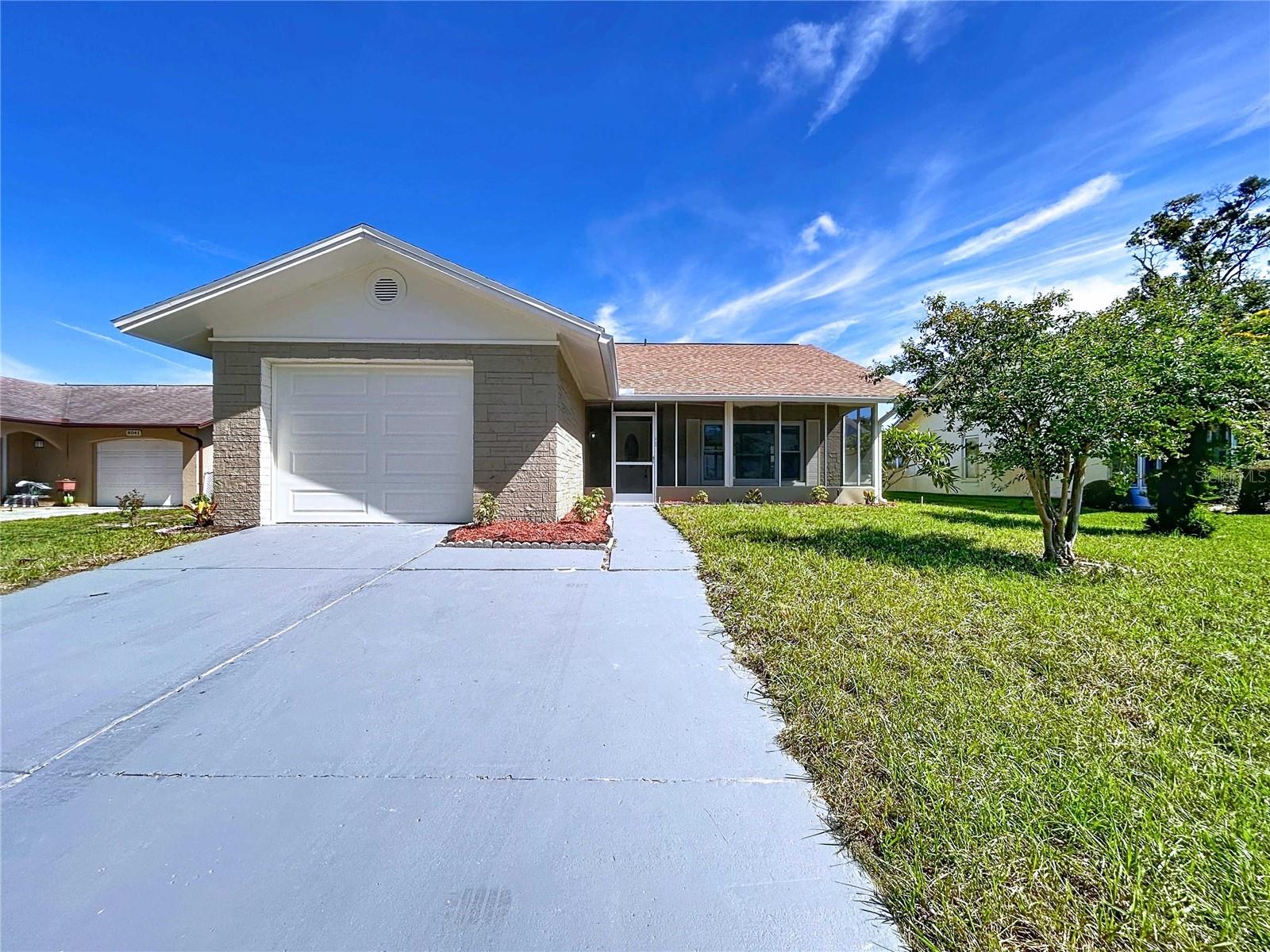 Move in Ready. Remodeled 2 bed, 2 bath, 1 Car Block home in Timber Oaks 55+ community. Home comes with New Roof, Updated Kitchen, Baths, windows, Doors, New Garage door, Luxury Vinyl Flooring and a newer AC System. Timber Oaks Community has a club house which hosts many activities, as well as pool, Tennis/Pickle ball courts, Fitness center, Library, Art studio and many more. Home has Front and Rear Screen Porch and a dedicated irrigation pump, The location is great, with easy access to US Hwy 19 and very close to Malls, Medical facilities, Shopping Centers.