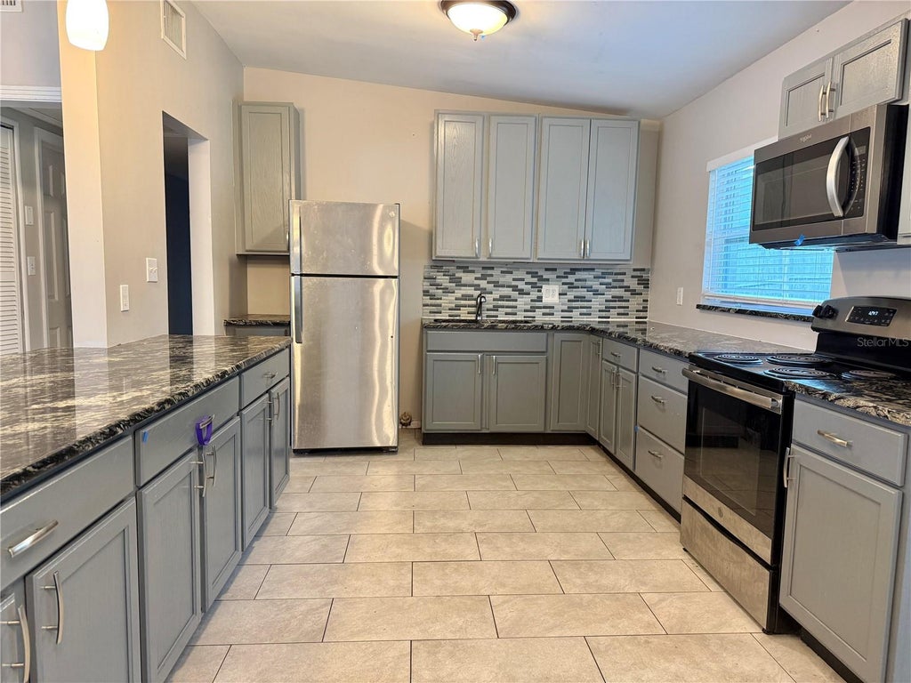 Photo of 5801 Judy Dee Drive, Orlando, FL 32808 (MLS # O6422448)