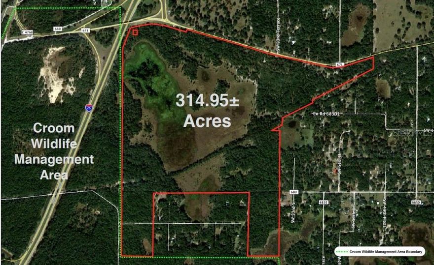 This irregular shaped property is located off of I-75 at Exit #309 in Sumter County, FL. It consists of 314.95± acres and is being used for cattle and hunting. The property begins at the southeast corner of I-75 & Exit #309 and has 1 mile of frontage along CR 673; all of which is high and dry back to a minimum depth of 500 ft. There are approximately 185 acres of uplands consisting of a mixture of open pasture and woods. The majority of the wetlands are a large lake on the northwestern portion of the property. The entire property has a barbwire fence and there are no structures.