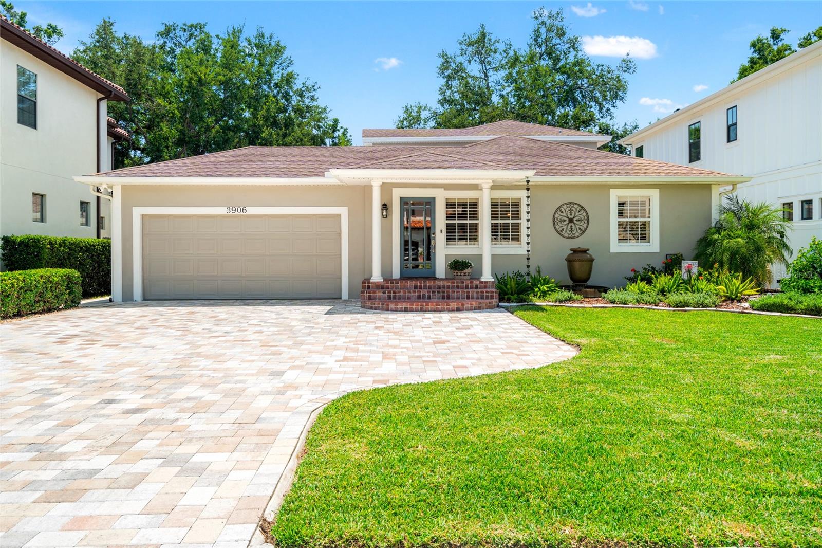 Welcome to Swann Estates! This beautifully updated 4BR/3BA bungalow sits on a HIGH & DRY street in Flood Zone X (meaning no flood insurance required by lenders) and offers a thoughtful floor plan with three bedrooms, including one primary suite, on the main level. The open-concept living area is ideal for entertaining, anchored by a GORMET KITCHEN featuring a massive marble island, custom shaker cabinetry, soft close drawers, stainless steel appliances with gas range and pot filler, built-in microwave drawer, under-cabinet lighting, and granite farmhouse sink. A WET BAR with beverage chiller and coffee station will make you the favorite party host. DUAL PRIMARY SUITES provide flexibility for multi-generational living or guests, with the upstairs primary retreat boasting a spacious layout, LARGE WALK-IN CLOSET plus shoe closet, double vanities, and a spa-like walk-in shower—all with a dedicated AC system. The DREAMY LAUNDRY ROOM is designed with custom cabinetry, leathered marble counters, soaking sink, Whirlpool front-load washer and gas dryer, and a tankless water heater. French doors open to a side porch, while the back of the home features a new composite deck spanning the width of the house, covered for year-round outdoor living and al fresco dining. The generous 60’ x 131’ lot allows ROOM FOR A POOL while preserving PLENTY OF YARD SPACE. A new paver driveway, reclaimed irrigation (low water bills!), and fresh landscaping enhance curb appeal. Rounding out the must haves, this home features a 2 CAR GARAGE. All of this in a prime South Tampa location, walkable to Trader Joe’s, LA Fitness, shops, dining, and zoned for A-rated GRADY ELEMENTARY, COLEMAN MIDDLE, and PLANT HIGH schools. Don’t miss this South Tampa gem! STOP BY AN OPEN HOUSE or CALL FOR YOUR PRIVATE SHOWING.