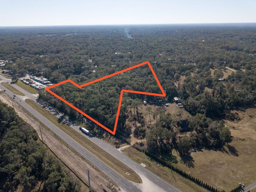 The possibilities are endless for this 5+ acres of vacant land located on North Hwy 17 with over 500 feet of highway frontage.  Property is located north of Spring Garden Ave Intersection.  Mixed zoning of Commercial and transitional AG.  Recent survey available. City water available.
