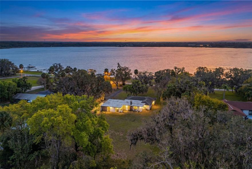 Welcome to lakefront living at its finest in the heart of Leesburg. Over 140 feet of direct waterfront!! Located at 9279 Silver Lake Drive, this beautifully positioned 2,300 square foot, 4-bedroom, 2-bath home sits on a rare double lot within the established Silver Lake Estates community, offering a total of 1.8 acres. 

From the moment you step inside, you’re greeted with expansive views of the lake that feel just as captivating indoors as they do outside. Large windows invite in an abundance of natural light, creating a warm, open atmosphere that perfectly complements the calm rhythm of lakefront living. Whether you’re enjoying a quiet morning coffee or winding down at sunset, the water is always part of the backdrop.

The generous lot size provides endless potential with room to expand, reimagine outdoor living spaces, or simply enjoy the privacy and breathing room that’s becoming increasingly hard to find. This is a home that offers flexibility, character, and the chance to truly make it your own.

Convenience meets lifestyle here as well. The property is just 1.9 miles from Leesburg International Airport and Lake-Sumter State College, 2.4 miles from Treadway Elementary School, and 2.7 miles from Lake Square Mall, keeping everyday needs and local amenities well within reach.

This is more than a home, it’s an opportunity to embrace space, views, and the timeless appeal of living on the water, all in a location that keeps you connected while still feeling like a retreat.