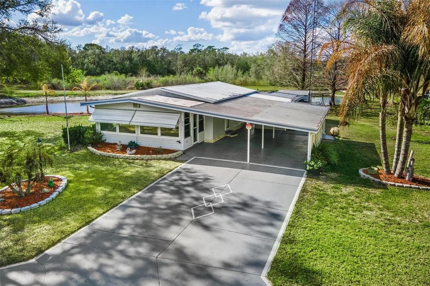 AFFORDABLE HOME...$149,900! Low HOA FEES! Located in one of Lady Lake’s best-hidden gems backs up to a scenic pond in Oak Grove, a desirable 55+ mobile home community, this charming 3-bedroom, 2-bath home offers comfort, convenience, and the Florida lifestyle you’ve been dreaming of...Step inside to a spacious living room filled with natural light. The kitchen features a cozy dining area, while the generously sized bedrooms and bathrooms provide plenty of space for comfortable living. Seller added the 3rd bedroom and Wall Air Unit that features a walk-in closet! Additional highlights include an extra bonus Florida Room with windows & cathedral aluminum ceiling plus Wall Air Unit for AC, a 2-car, oversized covered carport, and attached storage with convenient Laundry Room! Ideally located close to shopping, dining, and all the excitement of The Villages, this home offers both tranquility and accessibility. If you’ve been searching for affordable Florida living, this is your opportunity. Home is where your story begins — let me help you start your next chapter!