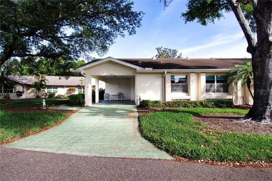 Move into this lovely 2 bedroom, 2 bath home and enjoy the peace and quiet it offers.  Located in the heart of Kings Point premier retirement community in a quiet neighborhood **** Away from the hustle and bustle of society.**** This home offers spacious rooms to relax and enjoy. There is a covered carport to keep your vehicle out of the Florida sun.  When you enter the home, the expansive living room, dining room combo makes the home feel open and light.  The kitchen has a pass-through window that opens up to the dining room. Kitchen is bright and roomy, perfect size for effortlessly preparing meals. Split bedroom plan. *BONUS* Pocket door can be closed to give the entire guest area privacy! The primary bedroom has a walk-in closet and ensuite bathroom with a walk-in shower. New Pergo floors throughout the home, tile in the kitchen. No carpet anywhere in the home. There is a nice Florida room in the back of the home with easy open windows to bring in the Florida fresh air on the cool days. On the side of the home is a small golf cart storage room. HVAC was replaced in 2024, water heater replaced in 2016, and an updated electric panel. Partially furnished if the buyer wants it. Kings Point is a private resort style retirement community that offers many amenities - indoor/outdoor pools, fitness center, 2 clubhouses, theater, sports bar and restaurant, a spa to get your hair and nails done or enjoy a massage. There are many sports to participate in and entertainment to enjoy. Clubs for just about anything that interest you. You can get around in Sun City Center with your golf cart, shopping, dining, doctors, and places of worship are plentiful. Short drive to beautiful Florida beaches or to the airport.  Come and see why this is a great place to retire and make new friends! ***Association will be pressure washing the exterior once the water restrictions are lifted***