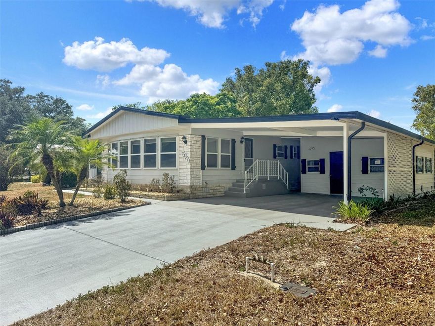 Welcome to this beautifully renovated 2-bedroom, 2-bath manufactured home located in the highly desirable 55+ community of Zellwood Station in Zellwood, Florida. Nestled within a secure, gated community spanning over 800 acres, this home offers the perfect blend of comfort, style, and resort-style living. Inside, you'll find a spacious layout featuring a large great room, perfect for entertaining or relaxing. The kitchen has been thoughtfully updated with brand-new stainless steel appliances, quartz countertops, and crisp cabinetry, offering both functionality and modern appeal. New laminate flooring runs throughout the home, enhancing its fresh and contemporary feel. Both full bathrooms have been tastefully renovated, and an updated electrical panel provides added peace of mind. A bright sunroom offers additional living space and is ideal for enjoying your morning coffee, reading, or hosting guests year-round.

Zellwood Station is more than just a neighborhood—it's a lifestyle. This active adult community boasts a wide range of amenities designed to support health, recreation, and social connection. Residents enjoy 24-hour security with a manned gatehouse, ensuring peace of mind. Golf enthusiasts will love the on-site 18-hole golf course and pro shop, open to both residents and the public. For dining and socializing, the Whistle Stop Restaurant, a shareholder-owned gem, offers great food and a friendly atmosphere, all without leaving the community. Just steps away, the Co-op Clubhouse hosts regular events, dances, and recreational activities, and features a swimming pool reserved for shareholders.

Fitness and wellness are easy to maintain with a dedicated fitness center equipped with cardio and strength training machines, as well as group classes like yoga, aquacise, and splash & dash. The community offers four swimming pools, including one heated year-round with a spa. Outdoor lovers can explore walking and biking trails, shuffleboard courts, three stocked fishing lakes, and dedicated tennis and pickleball courts. For daily conveniences and healthcare needs, residents have quick access to Advent Health in Apopka, Mount Dora, and Orlando. The nearby 429 Highway provides a direct route to world-class attractions like Disney World, Universal Studios, and other entertainment destinations.

Located just minutes from the charming towns of Mount Dora and Apopka, Zellwood Station is close to antique shops, local boutiques, art galleries, and a variety of restaurants. This home is truly move-in ready and provides an opportunity to enjoy the best of Central Florida living in a vibrant, well-maintained community. Don’t miss your chance to own this thoughtfully updated home in one of the area’s most sought-after 55+ communities. Schedule your private showing today and discover all that Zellwood Station has to offer.