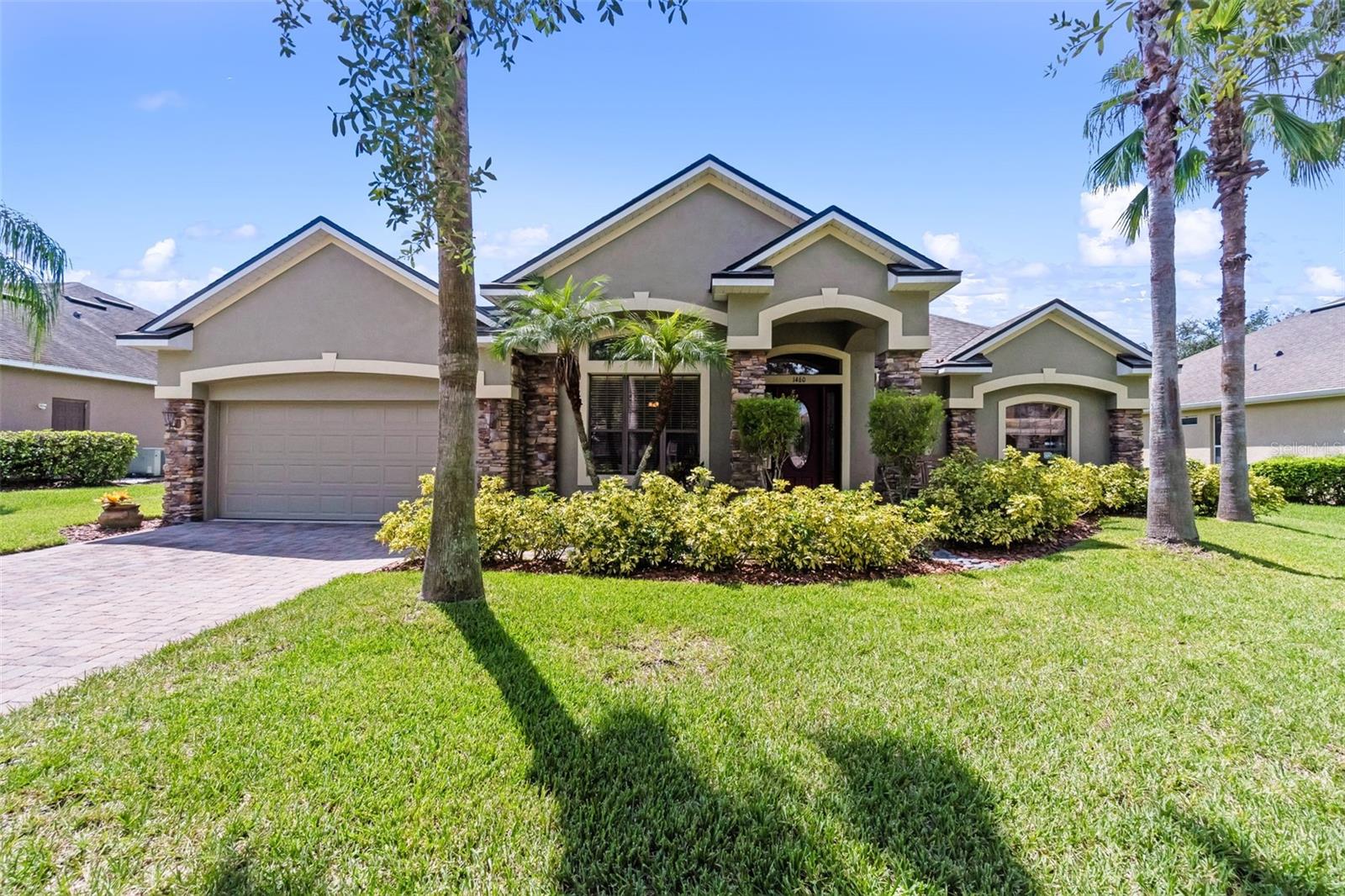 Serene Waterfront Living in Gated East Lake Park! Welcome to 1460 Prairie Oaks Drive, a Beautifully Maintained 3-bedroom, 2.5-bath home located in the desirable gated community of East Lake Park in Saint Cloud, Florida. This residence blends Modern Updates, Comfortable Living, and Serene Water Views in one perfect package. RECENT UPGRADES & PEACE of MIND; Brand-New Roof (2025), New HVAC System (2024) with 11-year transferable parts warranty, and Fresh Exterior Paint. These improvements ensure both beauty and long-term performance. RESORT-STYLE OUTDOOR LIVING; Step into your Private Backyard Oasis, where a Heated Swimming Pool with Waterfall Feature overlooks tranquil Pond Frontage. Whether relaxing in peace or entertaining family and friends, this retreat delivers year-round enjoyment. SPACIOUS INTERIOR; Inside, you’ll find open and airy living spaces, Three Comfortable Bedrooms, a Large Office tucked away from the Living Area, and Two Full Baths plus a Half Bath. The Thoughtful Floor Plan makes daily living easy and provides room for hosting guests. LOCATION, LOCATION, LOCATION; Nestled within East Lake Park, residents enjoy Gated Security and a Welcoming, Well-Kept Community. The home’s prime location near Lake Nona Medical City puts world-class healthcare, cutting-edge research, shopping, and dining just minutes away—all while offering the quiet charm of suburban living. Don’t miss your chance to experience the perfect balance of comfort, convenience, and natural beauty. Schedule your Private Tour today!