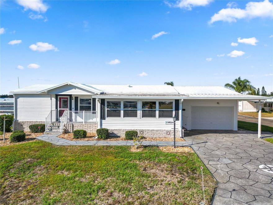 Looking to buy a home in Florida? This is a great manufactured home built in 2005. This home is in walking distance to the Clubhouse, pool, shuffleboard, corn hole, pickle ball, horseshoes and other amenities. It's just a walk across the street to all of this! The home is a 1242 square foot open concept home. The fully loaded kitchen includes a dishwasher, disposal, and a washer and dryer. This split concept home has the primary bedroom and large en-suite bathroom on one side of the home, while the guest bedroom and bath are located on the opposite side of the home. The entrance from the driveway is to a large front room, appoximately 200 sq. ft., and has sliding glass doors to the kitchen. Additionally, the home offers tinted double pane windows through out, linen closets in the bedrooms and hall, a single car garage with pull down for additional storage area above, the garage also features storage cabinets and counter space. The monthly maintenance fee includes cable TV, internet service, lawn care, water sewer, garbage pick up, maintenance of common building and grounds and use of all the facilities and amenities. With so much to offer, schedule your private showing today!