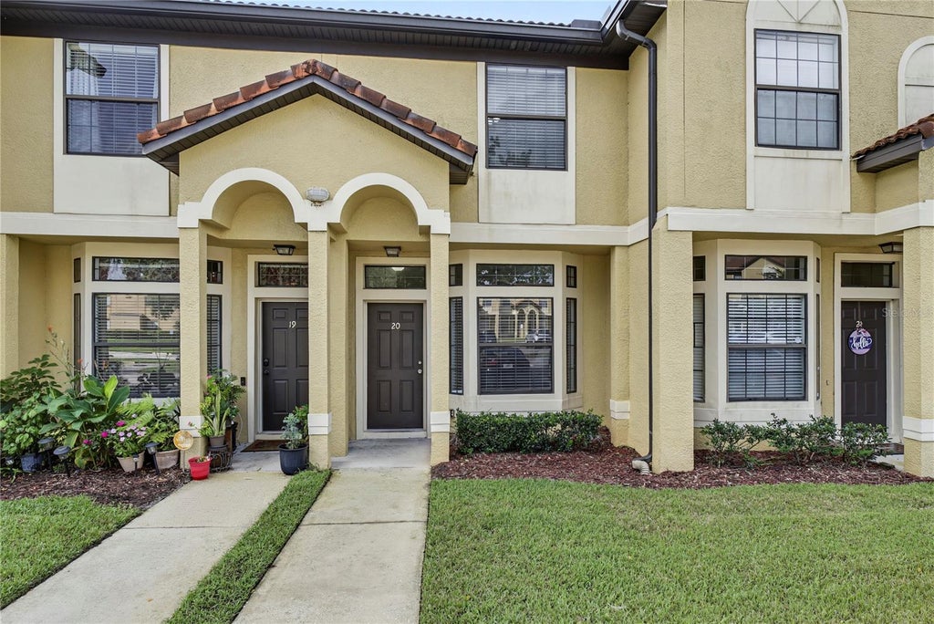 Photo of 6013 Scotchwood Gln Gln #20, Orlando, FL 32822 (MLS # O6444801)