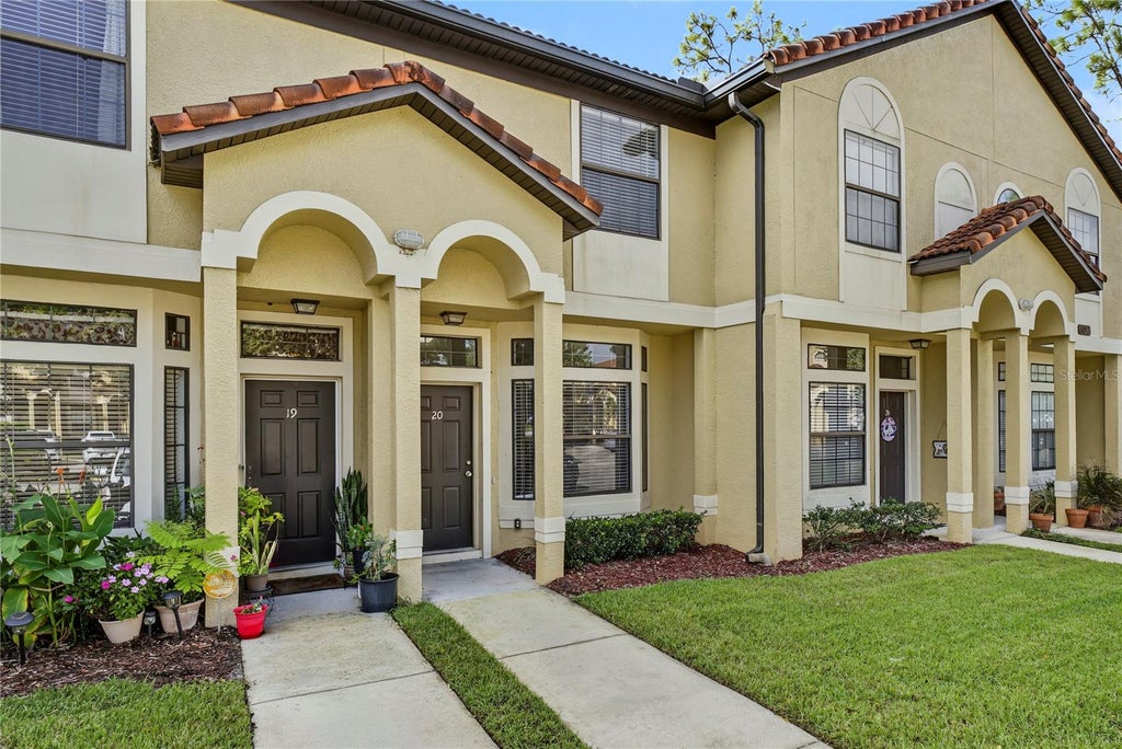 Photo of 6013 Scotchwood Gln Gln #20, Orlando, FL 32822 (MLS # O6444801)