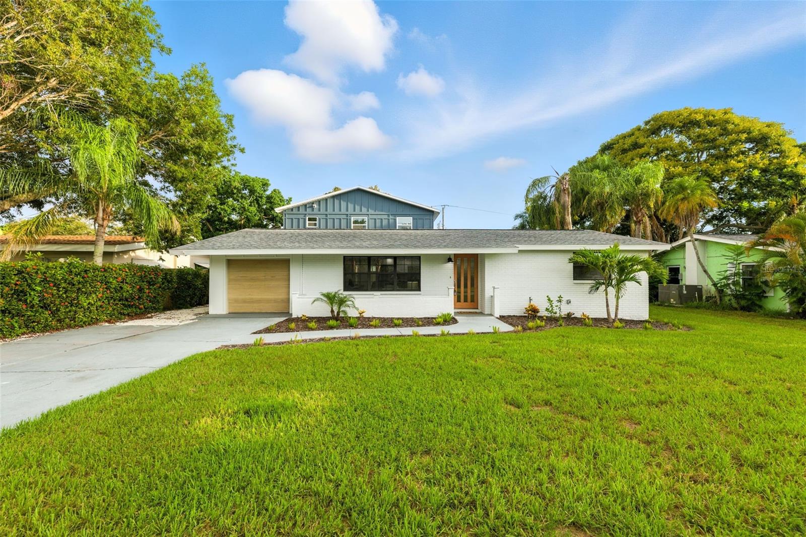 Coastal living awaits in this beautifully remodeled 3-bedroom, 3-bathroom pool home with a 1-car garage. The entire second floor is dedicated to the private primary suite, complete with an ensuite bathroom and a spacious walk-in closet. The kitchen is a true showstopper, featuring waterfall quartz countertops, a large peninsula island, stainless steel appliances, and a quartz backsplash. Two generous living areas provide plenty of space for both dining and relaxing, while a first-floor laundry room and a wet bar make entertaining effortless. Major updates include a 2022 roof, 2016 HVAC, 2023 electrical panel, and 2023 hot water heater. Step outside to your expansive backyard oasis, featuring a pool, pergola, storage shed, and plenty of space to relax, play, or entertain. Located in the heart of Bradenton, this home is just moments from the Bradenton Country Club, beautiful Gulf beaches, public boat ramps, shopping, and schools—and it’s in a non-flood zone.