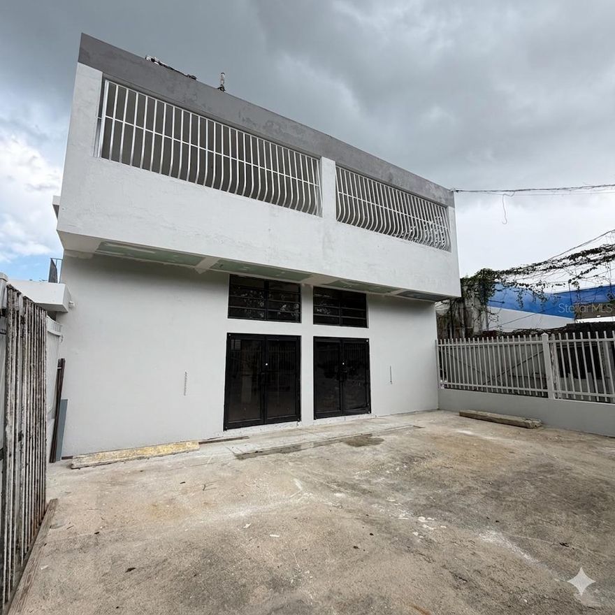 One or more photo(s) has been virtually staged. Strategic opportunity in the PR-2 commercial corridor in Toa Baja, located just steps from Arecibo Home Design. This independent commercial building spans a total of 3,392 sq. ft. and holds a C-I (Intermediate Commercial) zoning classification. This versatile zoning allows for a wide array of uses, including showrooms , professional and technical services , retail , commercial storage , and office spaces.The property boasts exceptional visibility and exposure with direct access to the main highway and a constant, high-traffic flow —ideal for any brand looking to maximize its presence. The layout is highly adaptable , subdivided into levels with independent entrances and separate electric meters , offering the flexibility for single-tenant or multi-unit occupancy. Furthermore, the property includes existing parking with expansion potential in the rear , a critical factor for success in this established and active commercial hub.