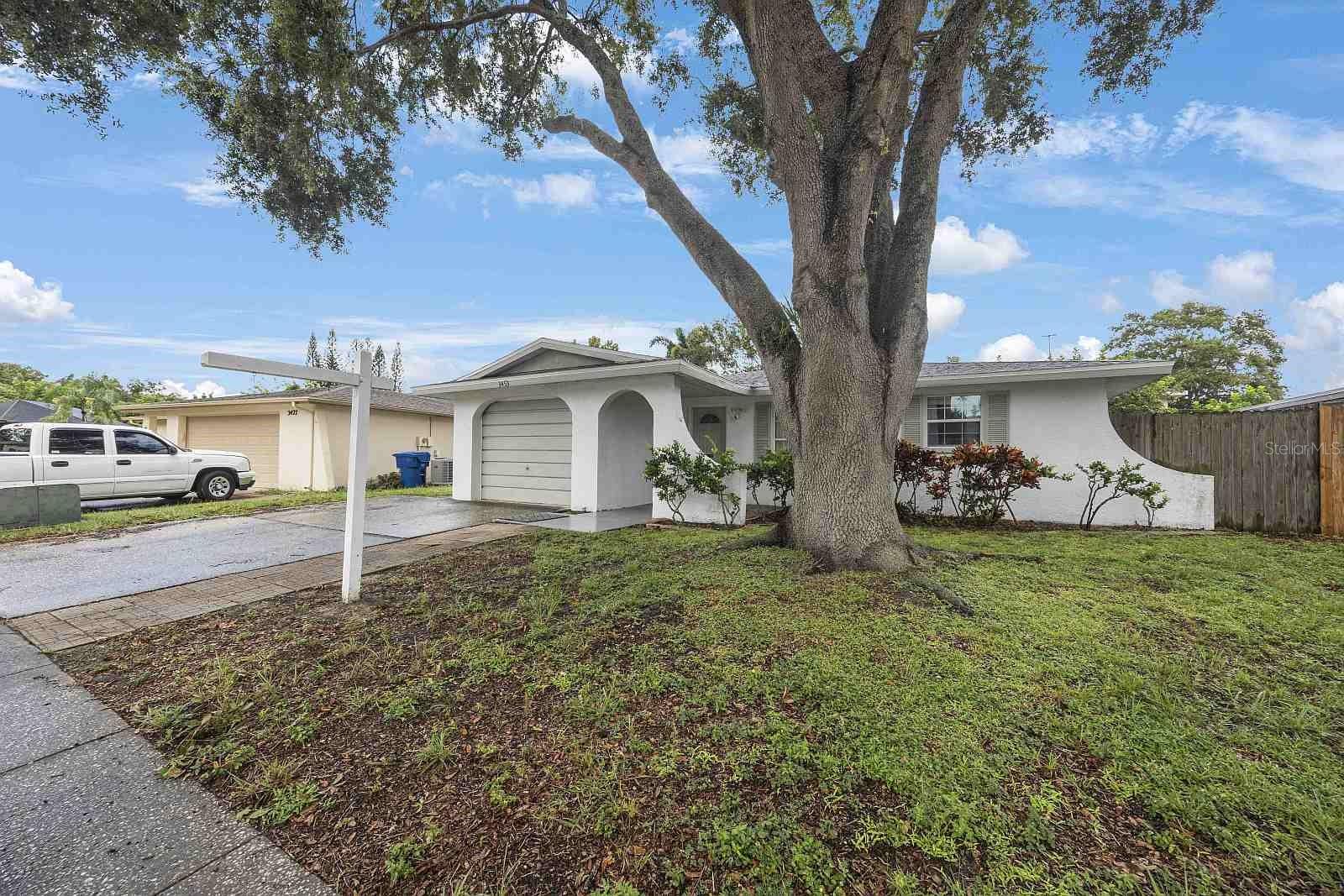 Live a tranquil life in sought-after Floral Gardens neighborhood. High and dry with no need for flood insurance, located just minutes to Largo’s nature preserve, shopping, movies and restaurants. The Kitchen/family room area is wide open measuring 20 by 22 feet and while spacious it still manages to feel intimate at the same time. The kitchen is a functional workspace with an island, plenty of counter area, cabinetry and storage. Built to last with concrete block, tile floors, baths and a brand-new roof with newer electric and a new AC system with an acceptable offer. Completely fenced back yard with a covered gazebo and patio area that’s ideal for grilling and entertaining. This 3 bed 2 bath is not a flip but a well-loved home that has been in the same family for decades. Easy to show, easy to buy and easy to maintain.