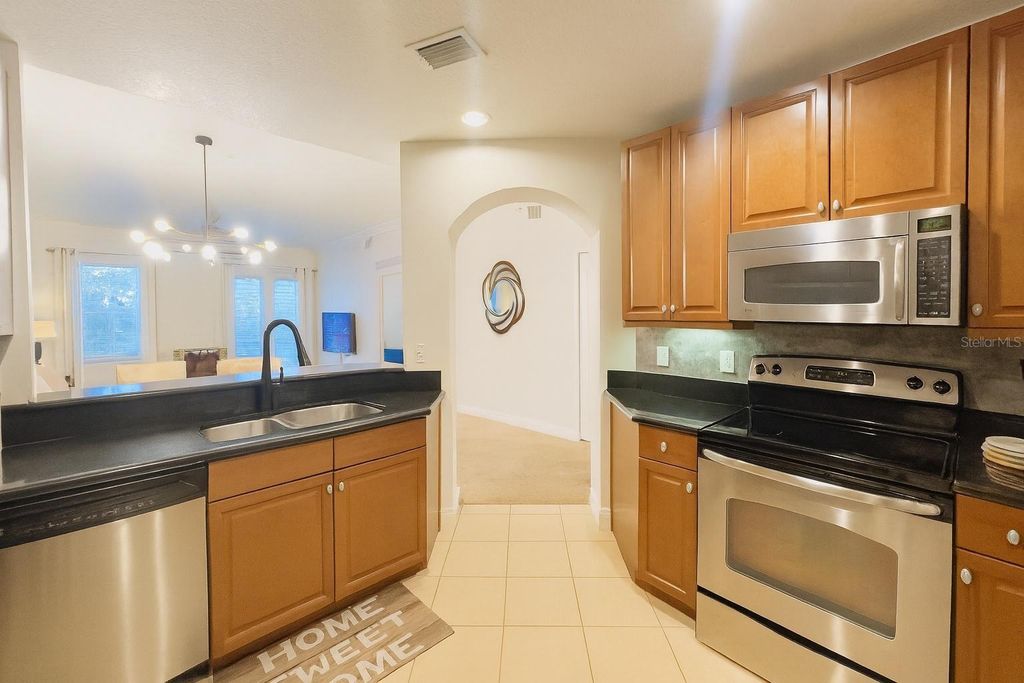 Photo of 7505 Mourning Dove Cir #302, Kissimmee, FL 34747 (MLS # O6347127)