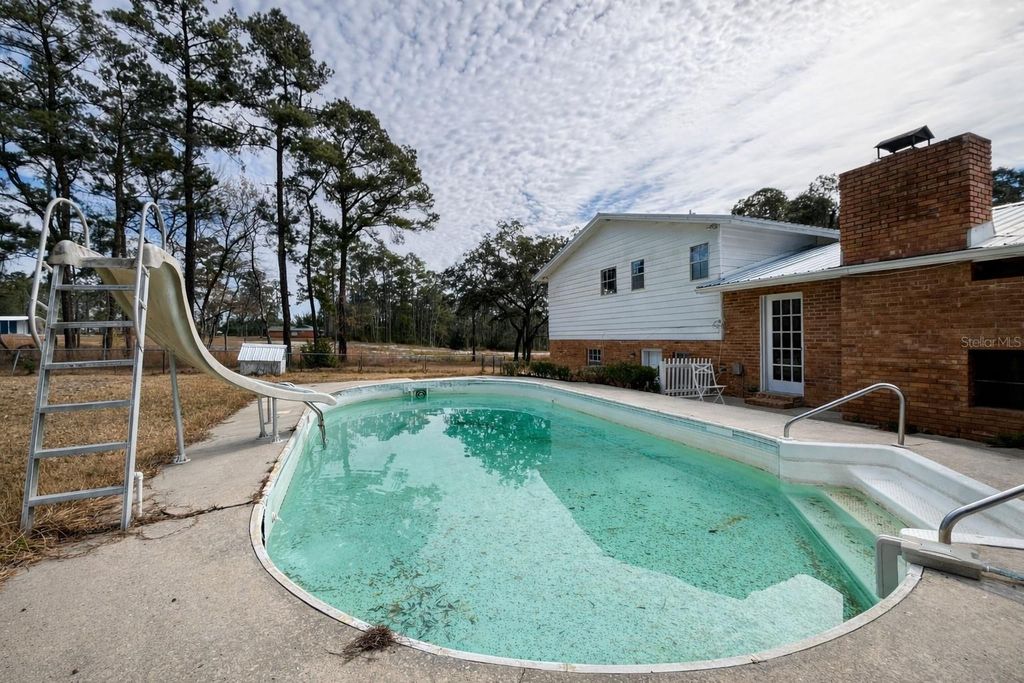 Photo of 355 SW Marvin Burnett Road, Lake City, FL 32025 (MLS # GC537583)