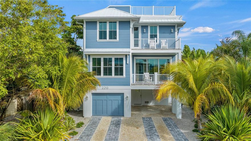 Escape to Coastal Luxury and Island Charm

nestled just a leisurely 5-minute stroll from the sun-kissed shores of Bradenton Beach, this newly built luxury home offers the ultimate coastal retreat. Boasting an impressive seven bedrooms and seven and a half bathrooms. Highlights include a dazzling private pool, rooftop deck, and a secluded hot tub for serene relaxation. Located in a tranquil neighborhood, this multi-level haven promises a blend of modern elegance and island charm.

A Home Designed for Relaxation and Entertainment
Step inside and discover a bright and airy second-floor open floorplan, ideal for entertaining. The living area features plush seating, a large flat-screen TV, and sliding patio doors that flood the space with natural light. The gourmet kitchen is a chef’s dream, complete with high-end appliances, custom cabinetry, and quartz countertops, along with a spacious island offering bar seating. Gather in the sunny dining room or head to the covered patio, where the sound of poolside fountains creates the perfect ambiance. 

Each of the seven bedrooms is thoughtfully designed to provide a restful retreat:

Primary Suite: Balcony access, ample storage, and a modern ensuite with double vanities, a walk-in shower, and a soaking tub.
Second Bedroom: Ensuite with a walk-in shower.
Third, Fourth, and Fifth Bedrooms: Spa-like ensuites, walk-in showers, and private balconies via sliding doors.
Sixth Bedroom: Quiet and cozy with an ensuite and walk-in shower.
Seventh Bedroom: Designed with younger guests in mind, offering space for games and an ensuite with a shower/tub combo.
A convenient third-floor dry bar with a refrigerator ensures easy access to snacks and beverages throughout your stay.

Outdoor Paradise
Step outside to your private oasis, where a sparkling pool, jetted spa, and grill await. Enjoy meals on the shaded patio or relax under the stars on the rooftop deck, taking in the coastal breezes.

Explore Island Life
This home places you in the heart of island adventures. Hop on the complimentary AMI Trolley to discover the vibrant shops and restaurants at the island's North End. Rent bikes, kayak the bay, or simply soak up the sun along the seven-mile coastline.