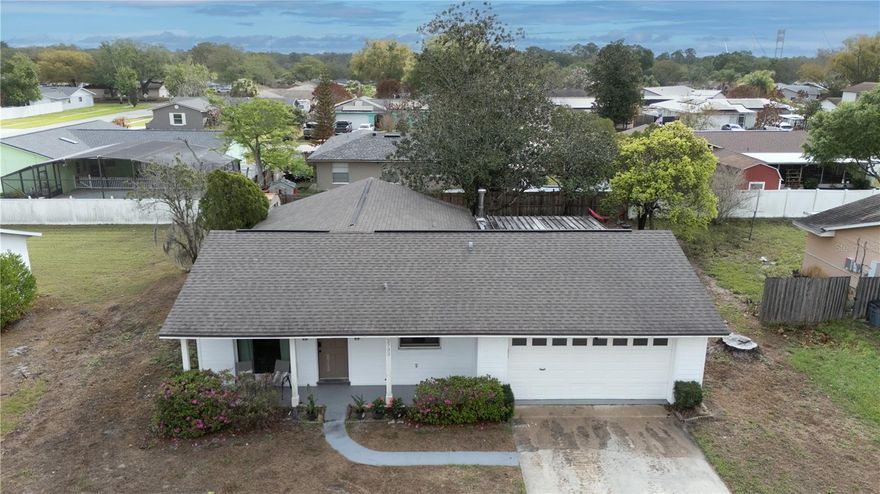 Welcome to this beautifully remodeled 3-bedroom, 2-bathroom home in the desirable Hanging Moss Estates—where modern upgrades meet timeless comfort. From the moment you arrive, you’re greeted by a charming covered front porch that sets the tone for what’s inside. Step into a thoughtfully designed interior featuring designer lighting and luxury vinyl plank flooring throughout the main living areas, creating a warm yet elevated ambiance. The stunning kitchen is truly the heart of the home, showcasing soft-close white shaker cabinets, elegant floating shelves, Carrara Marmi quartz countertops, a stylish backsplash, and brand-new stainless steel appliances—perfect for both everyday living and entertaining. Retreat to the spacious bedrooms, complete with plush carpeting, while the owner’s suite added comfort with a ceiling fan. Both bathrooms have been tastefully updated with modern vanities, mirrors, and high-end fixtures. Enjoy Florida living at its best in the covered and screened-in back porch, overlooking a fully fenced yard with ample space for relaxation, gatherings, or future enhancements. Additional highlights include a roof replaced in 2021, updated electrical panel, and the freedom of a NO HOA community. Conveniently located near shopping, major highways, UCF, and top-rated schools. This gem bring style, comfort, and location—don’t miss this opportunity!