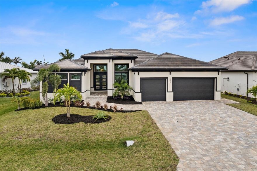 Welcome to your direct Gulf Access paradise! This stunning brand new, custom-built home awaits, with sweeping intersecting canal views across the EXTRA WIDE AND DEEP WATER BIMINI CANAL Just a brief boat ride to the Gulf of Mexico, restaurants, and beaches. This retreat offers 4 bedrooms, an office, and 5 bathrooms. The kitchen is a chef’s dream, with dual islands with quartz countertops and high-end stainless appliances. Bonus features include 2 icemakers, 2 full-size refrigerators, and a wine fridge. This amazing indoor/outdoor entertaining space features a linear electric fireplace in the living room, with 90-degree sliding doors to the patio. Your private oasis awaits outside, Enjoy all day sun at this SOUTH EASTERN EXPOSURE property complete with a saltwater pool, spa, and a fully equipped outdoor kitchen. Designed for safety, the home offers hurricane protection with impact windows/doors throughout. The 3-car garage provides ample space, and the expansive dock includes a 24,000 lb boat lift. No expense has been spared in creating this exceptional home.