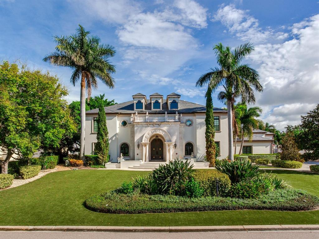 Please click the button to see the 3-D Matterport video tour. 4923 New Providence Avenue is a truly magnificent estate that only comes around once
in a blue moon. The quality, design, and attention to detail are unparalleled and
unlike anything else on the market. The home sits on an oversized lot in
Culbreth Isles at 21,312 square feet with imported Italian turf stretching the length of
the property. You immediately get the sense of the grandeur of this home as soon as you
enter through the 10-foot tall double steel doors and are immediately greeted by soaring
ceilings of 20 1/2 feet and a large wedding spiral staircase, inspired by the St. Regis
Atlanta (see entrance photo). The living room, visible from the entrance, is also 20 1/2
feet high. Which is centered by a solid stone fireplace, carved and shipped in one piece
from Turkey, that took a forklift driving through the front door while the home was
being built to install. Other one-of-a-kind features of the home include exceptional soundproofing in every single exterior wall to make sure you are not bothered by the outside
world while enjoying your home; a glass elevator with Carrera marble lined shaft that
looks up to a Chihuly inspired blown-glass fixture; a one of a kind cinema room, a
SONOS compatible system throughout the house, an industrial-sized generator that can
power the entire Estate for up to 2 weeks, the highest rated hurricane proof windows
throughout, and much more. All bathrooms upstairs have steam showers – nearly every toilet in the home is a TOTO toilet - the
master bathroom comes with two. Although there are four bedrooms and six full
bathrooms, the 13 1/2 foot ceiling cinema room has another bathroom which could
easily be converted to another master or even a large ballroom/entertainment space.
The fitness room can also easily be converted into another bedroom; giving buyers the
option for a six-bedroom home. The kitchen is an oversized gourmet chef’s dream with two full
ovens and 6 burners, all WOLF appliances that sit adjacent to a climate-controlled
wine cellar and butler's pantry. The house is full of redundancies to make sure you never
are short on space, such as having 3 full-size subzero refrigerators, 5 freezers and 2
refrigerator drawers in the kitchen and pantry alone. The fully custom kitchen is also
outfitted with a massive 10-foot island for seating, a restaurant-grade solid 5x5 foot
wood butcher's block, and banquet restaurant-style seating by windows that gazes out
over the exotic trees and backyard water oasis. This home also has a full three-car airconditioned garage with
height for car lifts and extra parking spaces for at least 12+ guests in the driveway. The
elaborate and exclusive outdoor entertainment space is highlighted by a cascading
infinity edge saltwater pool which is surrounded by a crushed coral deck that withstands the heat.
Finally leading to the bay are two cement docks (never
to be replicated in Culbreth Isles) that can easily house a 50-foot boat on the 30,000
pound-rated boat lifts, alongside a jet ski lift for two skis. From the home's concrete dock, one can see the open Bay.