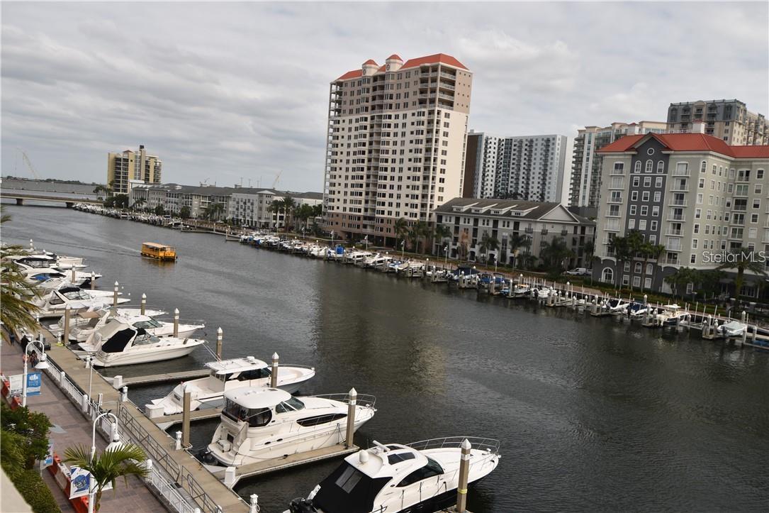 Waterfront Views at Luxurious Parkcrest - 2BR / 2BA - Fabulous upgraded Harbour Island condo with waterfront views within walking distance to Downtown Tampa and Channelside! Granite countertops, tile floors that look like wood - no carpet, stainless steel appliance package and upgraded lighting. Comes complete with all major appliances, including full-size washer & dryer. Beautiful pool and heated spa, club house, meeting room. pool table room and outside sitting areas.