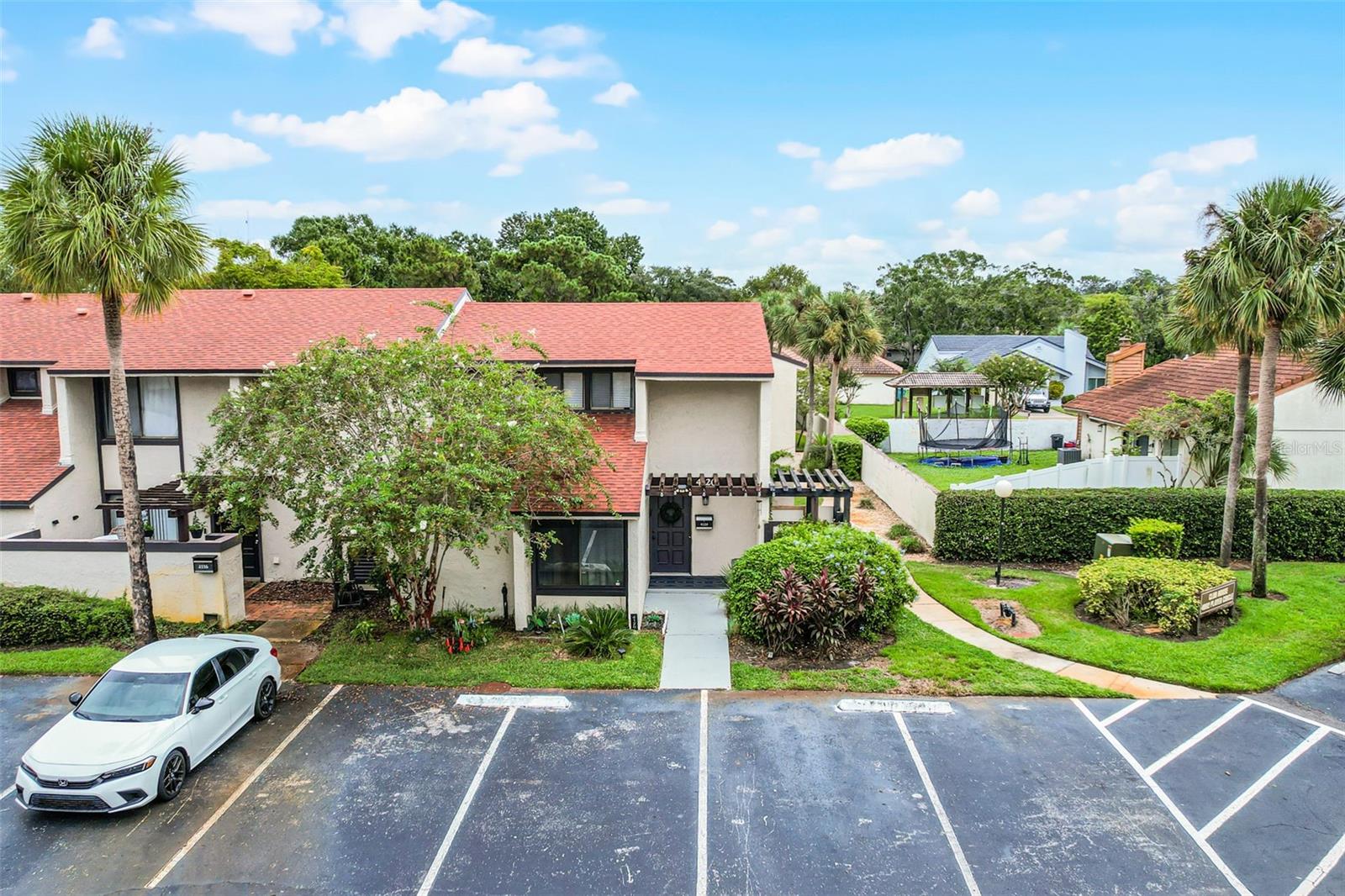 Beautifully maintained 2-bedroom, 2.5-bath END UNIT condo offering comfort and convenience. The flexible layout includes a primary suite option upstairs or downstairs, providing ease and privacy. Tasteful updates, abundant natural light, and an open feel enhance the home throughout. Step outside to your private backyard that backs directly to the community pool, creating a resort-style setting just beyond your sliding doors. Nestled in a quiet, well-kept community, this spacious condo is perfect for those seeking a low-maintenance lifestyle. Move-in ready and waiting for you!