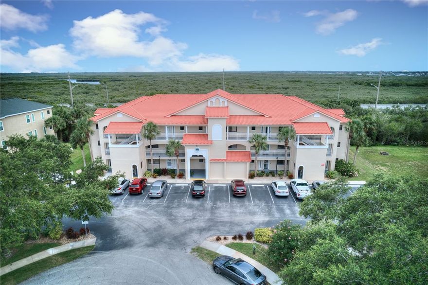 A BOATER'S DREAM!  This beautiful 2/2 overlooks the Preserve.  Bouchelle Island is a Resort Style Community located on the Intracoastal Waterway.  When you walk out of the new elevator you are at your front door.  As you enter the foyer onto the luxury vinyl flooring it leads you into the kitchen.  The beautiful renovated kitchen has granite counters, new stainless steel appliances which include a washer and dryer. The pass through counter into the dining area makes it easy to entertain.  As you are looking out from the living room onto the screened balcony, which has a large storage closet, you will see the canal running in front of the preserve.  The two spacious bedrooms have access to the remodeled bathrooms.  The primary bedroom has a walk-in closet. There are many luxurious amenities such as an 18 hole Pitch & Putt Golf Course, Two heated pools, gas grills, lighted shuffleboard courts, two lighted tennis courts, boat storage area, wet slips, floating dock, 3,000 feet of boardwalk. The boat slips and boat trailer parking are based on availability. Brand new air conditioning. There are additional amenities included... This seller is motivated!