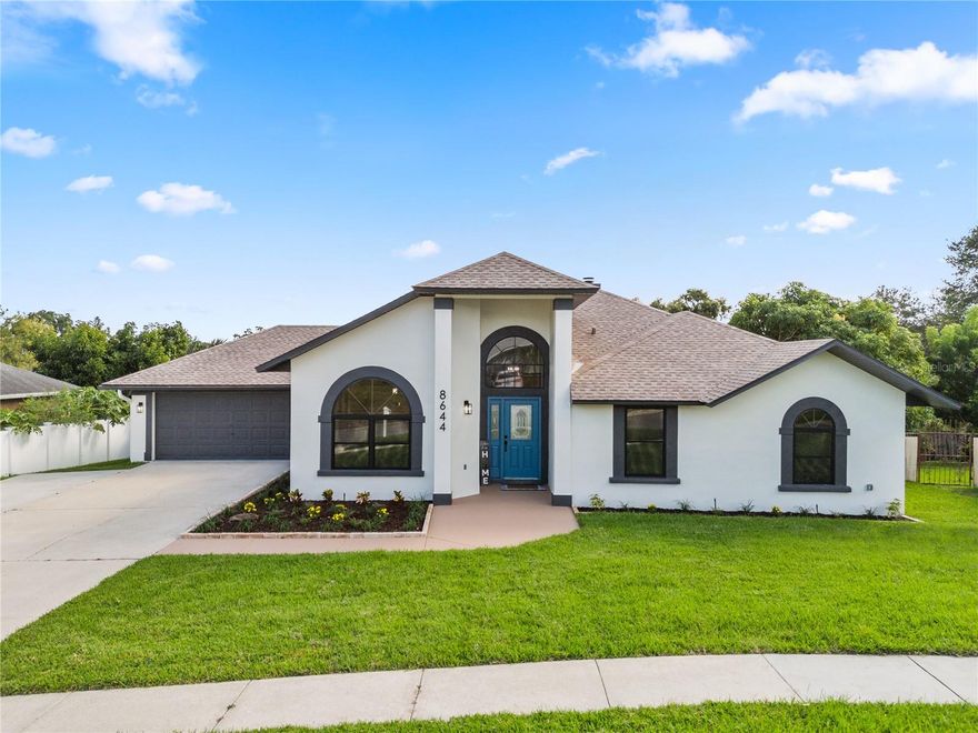 Under contract-accepting backup offers. Experience modern living at its finest in this stunning fully remodeled POOL HOME located in a NO HOA community! This spacious 3-bedroom, 2-bath residence offers nearly 2,000 sq ft of bright, open-concept living designed for both comfort and style.
Everything feels NEW! From the 2025 roof, 2025 A/C system, and 2024 water heater to the resurfaced pool (2025), new luxury vinyl flooring, fresh interior and exterior paint, new light fixtures, modern ceiling fans with remotes and a brand-new fence.
The designer kitchen is a true highlight, featuring gleaming quartz countertops, soft-closing cabinets, recessed lighting, and brand new stainless-steel appliances that elevate the home’s modern aesthetic. The open layout flows seamlessly into the large family room with vaulted ceilings and a cozy fireplace, perfect for gatherings, while the formal living-dining combo offers additional entertaining space.
The primary suite offers generous space and comfort, including a bonus room/den ideal for a home office, nursery, or private lounge. The luxury primary bathroom features two separate showers with stylish tile, a new frameless glass panel, and all new fixtures, faucets, mirrors, and elegant hardware, creating a spa-like experience.
The two additional bedrooms are spacious and filled with natural light, perfect for family or guests. The guest bathroom has been completely renovated, featuring new tile, new bathtub, modern fixtures, mirrors, faucets, and stylish hardware throughout.
Enjoy Florida living at its best with a sparkling pool, new sprinkler system, fresh sod and beautifully landscaped front garden, new septic tank, and a spacious driveway that accommodates up to six cars plus a two-car garage with a brand-new motor and epoxy-coated floor. Convenient indoor laundry adds practicality to your everyday life.
Located close to major highways, shopping, dining, and just 30 minutes from Disney, this move-in ready gem combines style, space, and location.
Don’t miss your chance. Schedule your private showing today!