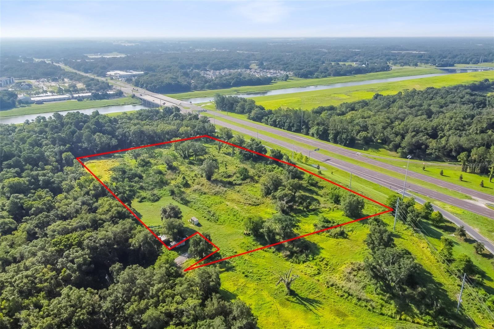 PRIME DEVELOPMENT OPPORTUNITY! Just listed, 15.56 Acre Site on Fowler Avenue at I-75 with great Visibility from I-75! Seller is willing to sell 4.75 and 8.56 acre lots separately and WILL CONSIDER HOLDING PAPER! It is currently zoned AR (Agricultural Rural) has a couple cows on it / Commercial-Industrial Zoning Potential Future Land Use: SMU-6 (6 units/ acre for residential) FAR: 0.5 - With 20% usage for roads and retention and .5 FAR - Approximately 232k SF of Warehouse Potential Approximately 1,600 LF frontage on Fowler Ave & I-75 ramp with Access from Morris Bridge Rd. NE Corner of the E Fowler Ave and I-75 intersection Closest Sewer and Water Connection is approximately 1,860 LF to the first lot, or 2,690 LF to the second lot. Per owner there is a A 4" Well dug to 240-260 Feet with 20 feet of casing is onsite. Site is a previous landfill, there maybe GOV Environmental dollars to help with development. Make your offer today before this property is taken in this low inventory market we are currently navigating here in Tampa Bay! THANK YOU!