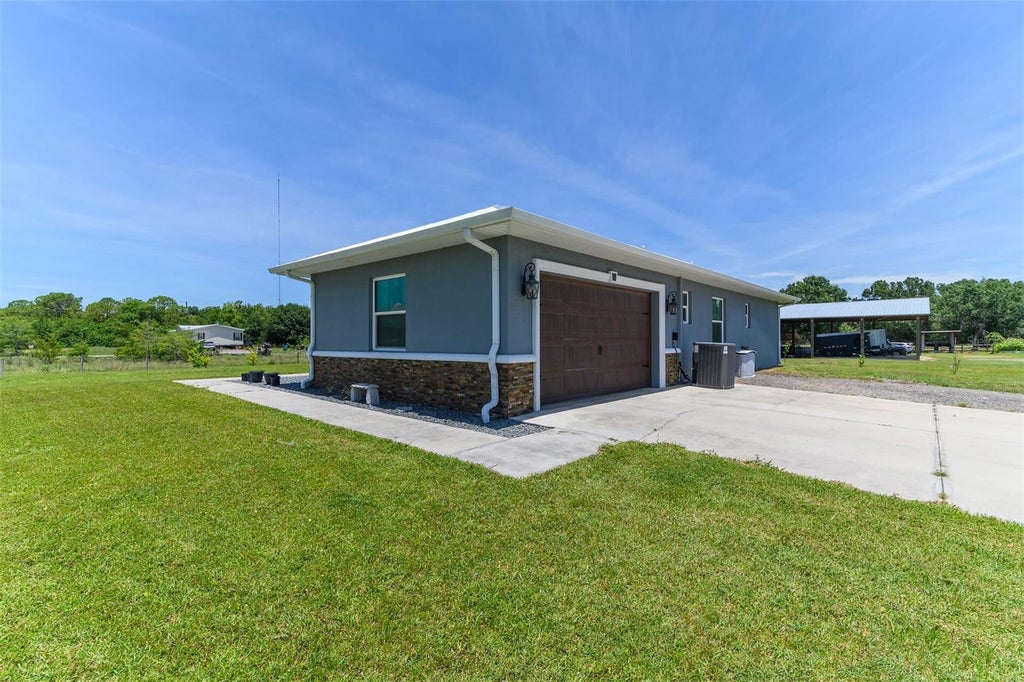 Photo of 40200 Little Farm Road, Punta Gorda, FL 33982 (MLS # OM726399)