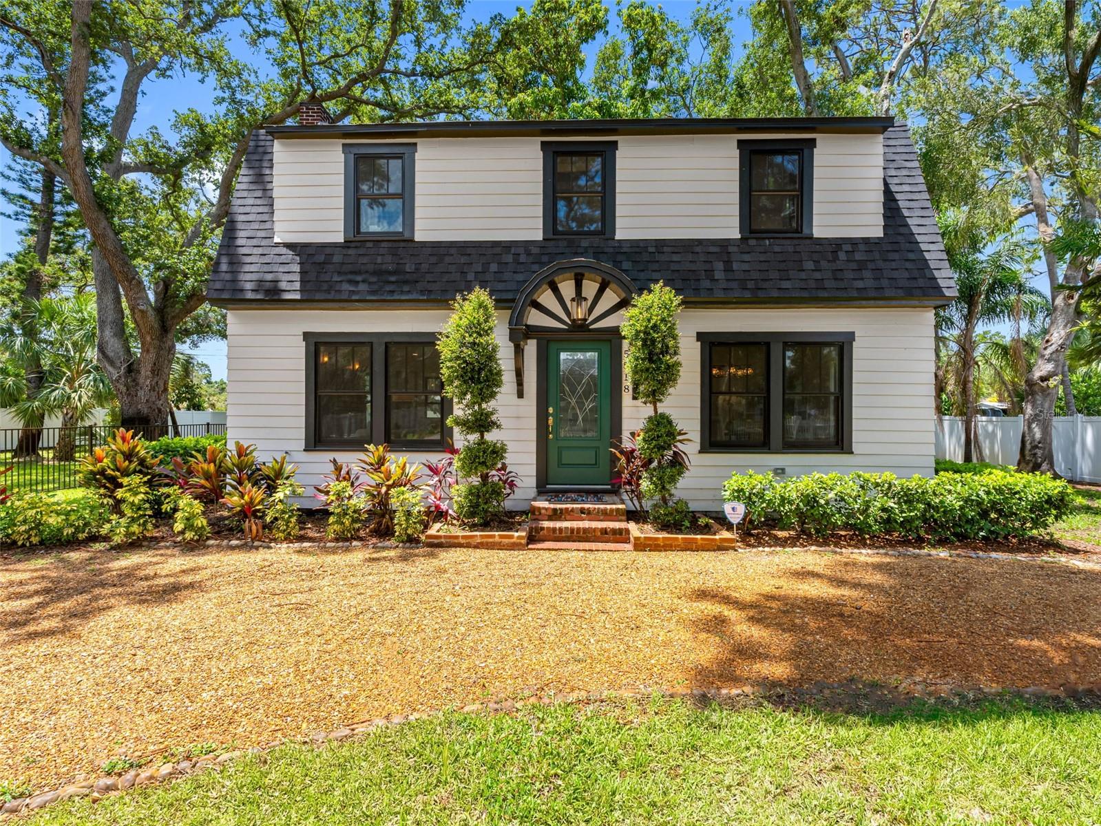 Sellers are motivated!
Discover this exquisite Dutch Colonial estate from 1924, meticulously preserved and on an oversized lot (1-1/2 lot) in the heart of Gulfport, known for its historic neighborhoods and vibrant arts scene. The home has been beautifully renovated, featuring upgraded systems and finishes while retaining its historic charm. It boasts three generous bedrooms and 2.5 baths, highlighting elegant quartz countertops and designer tile accents. Recent upgrades include a roof (2022), electrical and plumbing systems, an underfloor HVAC (2022) system for energy-efficient airflow, premium Andersen hurricane-impact windows (2022), new Hardie board siding, and uniform tile flooring for lasting durability and ease of maintenance. Original hardwood floors have been restored to their original beauty. At the heart of the home lies a chef's kitchen outfitted with high-end Café appliances, a stylish backsplash, quartz countertops and a delightful copper farmhouse sink. The inviting living room, adorned with 10-foot ceilings and large format windows, features the original 1920s brick fireplace. The formal dining room showcases period-appropriate moldings, while a beautifully restored wooden staircase with spindle balustrade leads to the upper level. Here, you'll find bedrooms equipped with built-in closet systems, period-style windows, and a primary en-suite bath featuring a frameless glass shower, dual vanities and imported ceramic tile. Step outside to the thoughtfully landscaped backyard, designed for entertaining and relaxation, where a composite wood deck encircles a mature mango tree, offering seasonal fruit and shade. Just moments from the vibrant Gulfport Art District, pristine beaches, golf, Pasadena Yacht and Country Club, and an array of fine dining and shopping options, this residence offers proximity to upscale coastal amenities. At 16 feet above sea level, this property is in Flood Zone X, which is not classified as a high-risk flood area according to FEMA. Flood insurance is not required.
Qualified buyers may receive a 1-year interest rate buydown for the first year paid for by the Seller's preferred lender when financing this home (subject to credit approval and program availability) - call today for details!