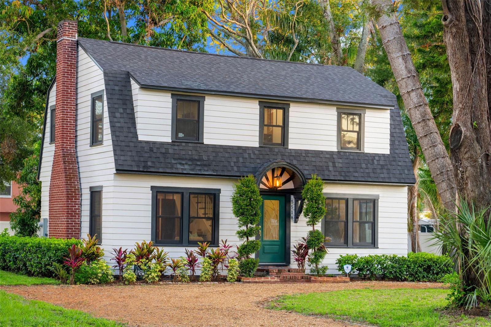 Discover this exquisite Dutch Colonial estate from 1924, meticulously preserved and on an oversized lot (1-1/2 lot) in the heart of Gulfport, known for its historic neighborhoods and vibrant arts scene. The home has been beautifully renovated, featuring upgraded systems and finishes while retaining its historic charm. It boasts three generous bedrooms and 2.5 baths, highlighting elegant quartz countertops and designer tile accents. Recent upgrades include a new roof, new electrical and plumbing systems, an underfloor HVAC system for energy-efficient airflow, premium Andersen hurricane-impact windows, new Hardie board siding, and uniform tile flooring for lasting durability and ease of maintenance. Original hardwood floors have been restored to their original beauty. At the heart of the home lies a chef's kitchen outfitted with high-end Café appliances, a stylish backsplash, quartz countertops and a delightful copper farmhouse sink. The inviting living room, adorned with 10-foot ceilings and large format windows, features the original 1920s brick fireplace. The formal dining room showcases period-appropriate moldings, while a beautifully restored wooden staircase with spindle balustrade leads to the upper level. Here, you'll find bedrooms equipped with built-in closet systems, period-style windows, and a primary en-suite bath featuring a frameless glass shower, dual vanities and imported ceramic tile. Step outside to the thoughtfully landscaped backyard, designed for entertaining and relaxation, where a composite wood deck encircles a mature mango tree, offering seasonal fruit and shade. Just moments from the vibrant Gulfport Art District, pristine beaches, golf, Pasadena Yacht and Country Club, and an array of fine dining and shopping options, this residence offers proximity to upscale coastal amenities. At 16 feet above sea level, this property is in Flood Zone X, which is not classified as a high-risk flood area according to FEMA. Flood insurance is not required. Please note: The vacant lot on the east side is also available for sale, offering endless possibilities — build another home, add a pool, create a private garden oasis or explore other development options! Don’t miss your chance to own this remarkable home.
Qualified buyers may receive a 1-year interest rate buy down for the first year when financing this home with Chris Musto – NMLS 107227 at Select Lending Services. Rate buy down will be paid for by the lender.
Seller financing is also available!