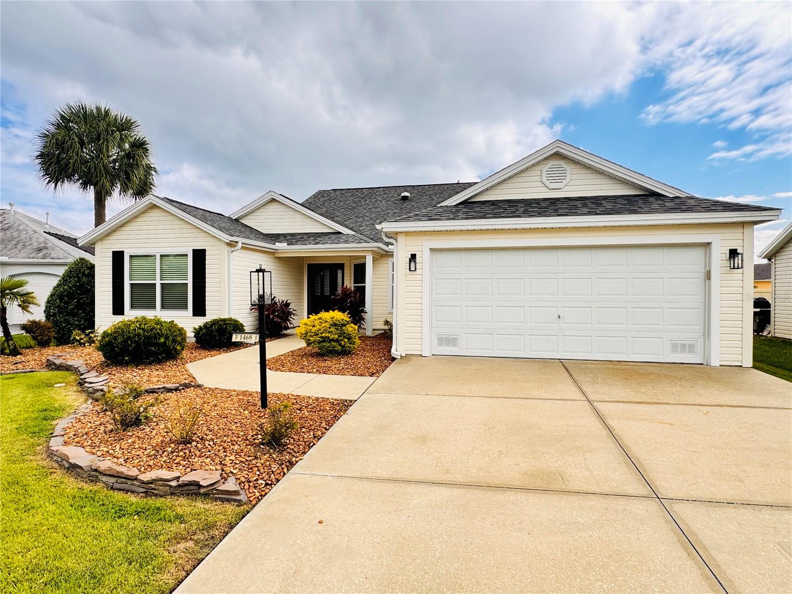 Welcome to this beautifully maintained 3-bedroom, 2-bath Camellia Designer Home offering 1,979 sq. ft. of living space in the desirable Village of Poinciana. Tucked away at the end of a quiet cul-de-sac, this home provides wonderful privacy, no through traffic, and a peaceful backyard retreat.Inside, you’ll find engineered hardwood floors in the main living areas (no carpet!) and a very large living room and dining room, perfect for entertaining. The eat-in kitchen features granite countertops and ample cabinet space.The huge main bedroom suite offers dual closets, dual sinks, large linen closet, and a separate shower and toilet area for privacy. Both guest rooms include closets, and the expanded laundry room adds excellent storage with multiple cabinets and a utility closet.Step outside to your own private oasis — an oversized lanai featuring an in-ground spa and a private rear yard with a wall. The landscaping is beautifully lit at night for dramatic ambiance, creating the perfect space to relax or entertain.Additional features include:Roof 2019 50 yr shingles,HVAC 8/2021,Hot Water Heater 8/2025, Water Softener,5 Solar Tubes,Attic Fans,Instant Hot water throughout & NO BOND!!!!!This home has been lovingly maintained and is move-in ready, offering comfort, privacy, and convenience — all in the heart of The Villages lifestyle! Just minutes from Lake Sumter, golf, pools, shopping, & Dining! Call me today!