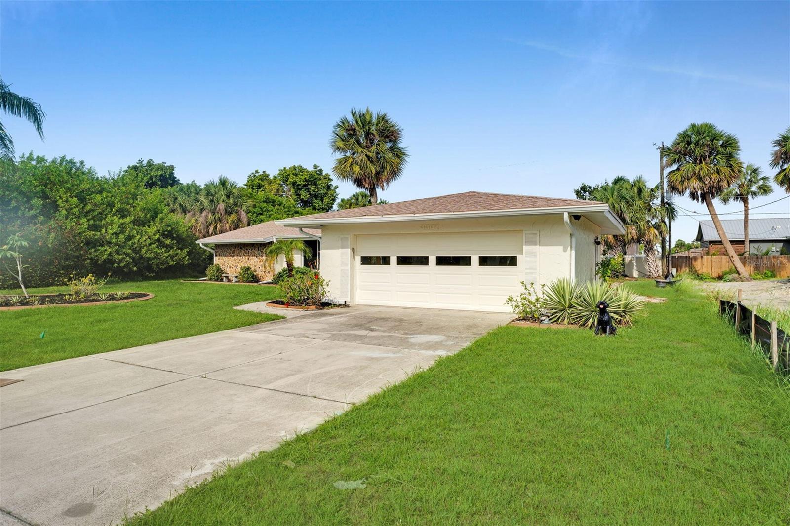 Welcome to this completely renovated 3-bedroom, 2-bathroom pool home with 2-car garage in Port Charlotte! This stunning 1,547 square foot home was fully renovated in 2025 and is move-in ready. The open-concept layout features a beautiful kitchen with spacious island, breakfast bar seating, granite countertops, and brand-new appliances. Elegant tile flooring flows throughout the home, creating a seamless and easy-to-maintain living environment. The master bedroom provides a comfortable retreat and features an updated bathroom with walk-in shower. Two additional bedrooms has flexible space for family or guests, with a second full bathroom that has been completely updated. Step outside to enjoy your screened-in pool surrounded by a large garden area. This private backyard space is for relaxation and enjoying the Florida weather year-round. This home features premium upgrades including impact windows and impact sliding doors for hurricane protection, brand-new HVAC system installed in 2024, and new roof completed in 2024. The entire home has been freshly painted, and every detail has been thoughtfully updated. Located in Port Charlotte, you’ll have convenient access to local amenities, shopping, dining, and recreational activities. This completely renovated, move-in ready home has modern comfort and Florida living at its finest.