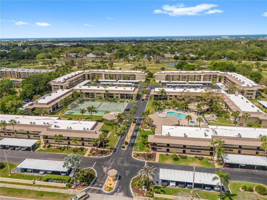 Welcome to this well-maintained ground floor condo in Villas De Golf, one of Largo’s most desirable 55+ communities, perfectly positioned on the beautiful City of Largo Golf Course. This move-in-ready unit offers a spacious and functional layout with a bright kitchen featuring ample cabinet space and newer appliances, seamlessly flowing into the open dining and living areas, ideal for both everyday living and entertaining. Enjoy peaceful golf course views right from your living room and relax on your private patio, the perfect spot for morning coffee or unwinding in the Florida sunshine.  This condo features two generously sized bedrooms with a split layout for added privacy. The secondary bedroom sits just off the kitchen and includes its own en-suite bathroom with a stand-up shower, while the primary suite is tucked toward the rear of the unit and offers a walk-in closet and a spacious en-suite bathroom with a separate tub and shower area. Major updates include a new A/C (2024) and hot water heater (2023), giving buyers peace of mind.  Residents of Villas De Golf enjoy an active, maintenance-free lifestyle with community events like golf outings, social gatherings, and holiday celebrations, all just steps from the clubhouse. Located in the heart of Largo, you are minutes from shopping, dining, and everyday conveniences, plus only about 2 miles to the stunning Gulf beaches. With easy access to Busch Gardens Tampa Bay, Walt Disney World, SeaWorld Orlando, and LEGOLAND Florida Resort, along with two major airports within 30 minutes, this location offers the perfect blend of relaxation and accessibility. Whether you are looking for a full-time residence or a seasonal Florida retreat, this condo delivers comfort, convenience, and a true resort-style living experience.