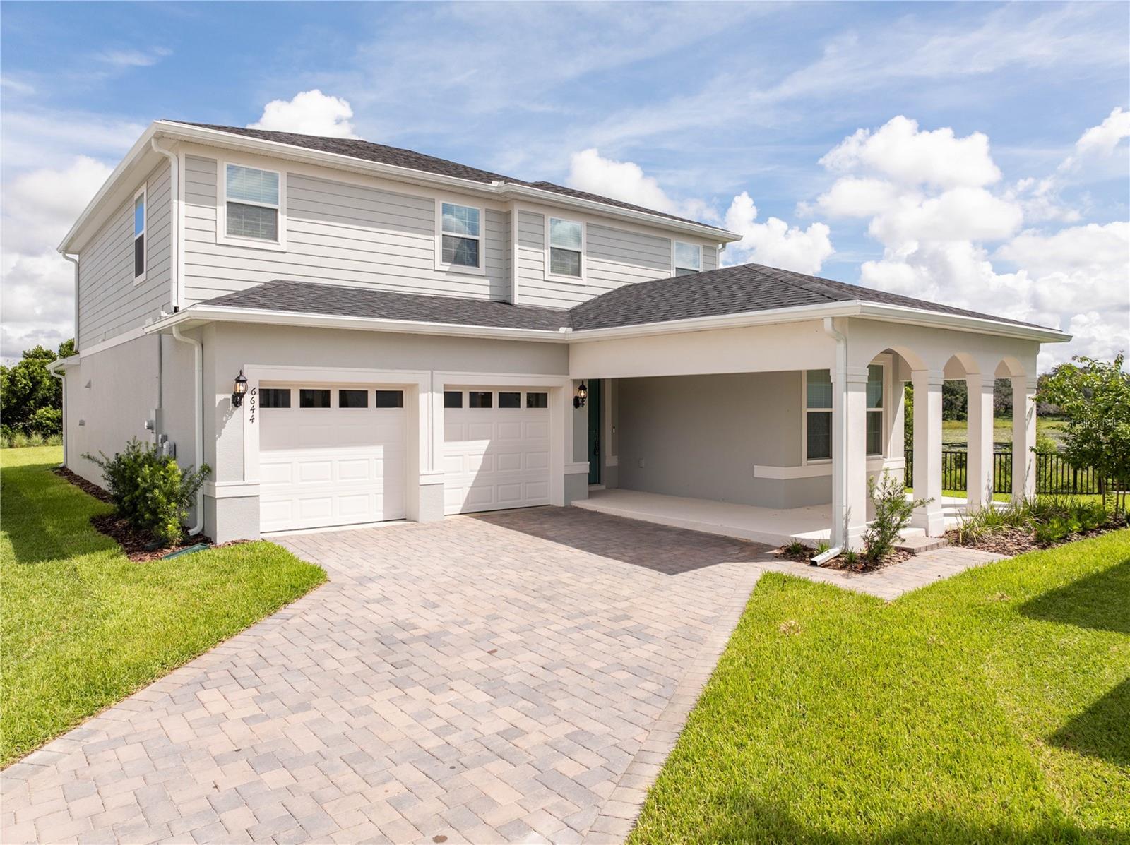 Step into this brand-new, never-before-lived-in home in the highly desirable Silverleaf Oaks community of Winter Garden. Recently closed and ready for its first residents, this home offers one of the most coveted homesites in the neighborhood with breathtaking lake views and a spacious backyard, perfect for entertaining, relaxing, or simply enjoying the tranquil lake view.
Inside, you will find over 2,600 square feet of thoughtfully designed living space with 5 bedrooms and 3.5 baths. The open floor plan showcases a gourmet kitchen, fully upgraded cabinetry, quartz countertops, stainless steel appliances and an island that flows seamlessly into the dining and living areas. The main level also includes a versatile first-floor bedroom that works perfectly as a guest suite or home office. Upstairs, the masters bedroom is a true sanctuary, featuring a luxurious en-suite bath with dual sinks, a large walk-in shower, and an expansive closet.
Three additional bedrooms, a generous loft, and a convenient laundry room complete the second floor, offering plenty of space for family and guests.
This home is equipped with modern smart-home technology, energy-efficient construction and elegant details throughout, ensuring both comfort and style.
Outdoor living is just as impressive, with a covered lanai overlooking the lake and ample backyard space.
Beyond the home, Silverleaf Oaks offers a resort-style lifestyle with community amenities including a sparkling pool with cabana, playground, dog park, walking trails, and open green spaces. All of this, with no CDD.
Ideally located near top-rated schools (some within the community itself) and just minutes from Hamlin Town Center with conveniences like Walmart, Publix, and restaurants, shopping, and entertainment. This home blends luxury, convenience, and community living in one perfect rental opportunity.