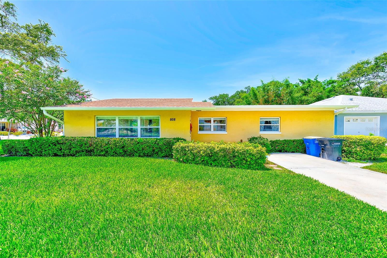 Charming 3-Bedroom, 2 1/2-Bath Block Home on a Spacious Corner Lot. Welcome to this meticulously maintained 1,350 sq. ft. solid block home, perfectly situated on a large corner lot. As you step inside, you’re greeted by vaulted ceilings with exposed white wood beams and an abundance of natural light, creating a warm and inviting atmosphere. The split floor plan offers both functionality and privacy, making this home ideal for families and guests alike. The kitchen features granite countertops, solid wood cabinetry, stainless steel appliances, and a brand new fridge and dishwasher. A convenient breakfast bar and an in-kitchen laundry closet add to the home’s thoughtful design. The spacious primary suite boasts dual closets and an ensuite bathroom with a unique pass-through option for guest access. On the opposite side of the home, two additional bedrooms each with a walk-in closets and share a Jack-and-Jill style bathroom with private vanities and a central shower.
Step through the sliding doors into your private retreat: a screened-in, paved patio overlooking the expansive backyard, perfect for entertaining or quiet evenings. A shed provides additional storage space for all your outdoor needs. With a new roof (2023) and new AC (2023), this home blends peace of mind with timeless comfort. This property combines modern updates with a functional layout in a sought-after location—ready for you to move in and make it your own. Just 10 minutes from world-famous Clearwater Beach, this home is close to Pier 60, Coachman Park, and the Clearwater Marine Aquarium, offering endless recreation and family fun. Nearby Sand Key Park, Honeymoon Island, and a variety of dining, festivals, and trolley access make it easy to enjoy the best of coastal Florida living.