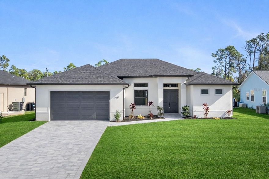 MOVE-IN READY NEW CONSTRUCTION  This home features an GREEN BELT LOT  offering rare kind of space which allows for Room for the Pool, Rare GREEN BELT lot offering unmatched flexibility.  Also features full hurricane-IMPACT WINDOWS and DOORS, an extended oversized garage, and spacious covered lanai already pre-plumbed for your future outdoor kitchen.  Offering 3 bedrooms, 2 bathrooms, plus a Flexible Den that can easily function as a 4th bedroom / office, or additional living space, the layout is designed for modern living. As you step inside, you’re welcomed by soaring tray ceilings and expansive 3 panel sliding glass doors that seamlessly connect the interior to the oversized lanai and private backyard — creating an exceptional indoor-outdoor living experience.    At the center of the home is a beautifully appointed chef’s kitchen featuring an impressive 10-foot quartz island, upgraded LG stainless steel appliances, abundant cabinetry perfect for entertaining or everyday comfort.    The primary suite is a private retreat complete with tray ceilings, a generous walk-in closets, and a spa-inspired bathroom showcasing DUAL SHOWERS and VANITIES, oversized walk-in showers with glass enclosures, and an expanded layout designed for convenience and relaxation.    Premium Upgrades Include:  Full hurricane-impact windows and doors Paver driveway with upgraded landscaping  Large covered lanai pre-plumbed for outdoor kitchen  Extended oversized garage ideal for larger vehicles or trucks  Recessed A/C system in garage for climate-controlled storage  Luxury LVP flooring throughout  Glass French doors in the den  Laundry room with built-in shelving  Upgraded elongated toilets and Moen Genta fixtures  Nest WiFi smart thermostat for remote climate control, NON Flood Zone lot for added peace of mind.