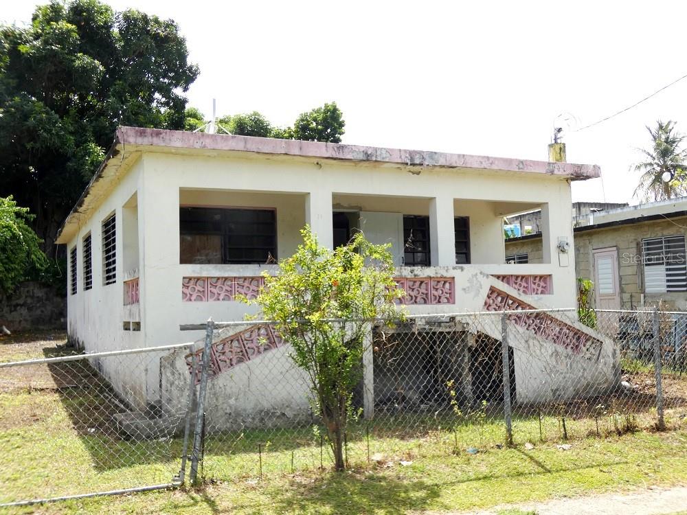 FIXER UPPER STARTER HOME IN LAS MARIAS. Three bedroom one bath home in need of repairs and TLC on a 354.90 square meter lot. Located on the quietest street in Las Marias, with little through traffic and few neighbors across the street. Elevated front porch with double staircases. Comfortable kitchen-family room combination, with eat-in space in the kitchen. Unfinished casita and paved patio area in the back. Nice flat yard with star fruit, soursop & mangos. Titled.