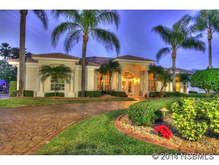 America's Premiere Fly-In, Gated, Country Club community; 4000' paved runway w/GPS approach & VASI lights; 24/7 roving security. Only min. to restaurants, shopping & theater; 15 min from World's Most Famous Beach, Daytona, 20 min to Embry Riddle Aeronautical Univ., 1 hour to Orlando & 3 hours to Miami. Gorgeous golf course home, meticulously maintained, located in the Country Club Estates subdivision w/ exceptional views of the 10th green & ponds.  Recent improvements include newer kitchen, pool & lanai area in 2009.  A/C units new 2012. Oversized circular concrete-stamped driveway, concrete block construction, barrel tile roof, 3-car garage, oversized back yard, screened in pool w/pavers, 4 bedrooms, 3 baths, 12 foot ceilings, Plantation shutters, 18" tile throughout except bedrooms, 5" baseboards, leaded glass front entry doors, open floor plan boasting arches, trey ceilings, extensive crown molding, great room w/entertainment center & coral stone fireplace, beautiful dining room with wainscoting paneling/double crown molding, eat-in kitchen w/solid counters, 42" cabinetry, gas range, laundry room w/splash tub, owners suite w/corner fireplace, owners bath w/walk-in shower, jetted tub, & double vanities & upgraded landscaping package. Located walking distance to the Country Club, golf, tennis, & fitness center. Furnishings available for sale. ;Water: City