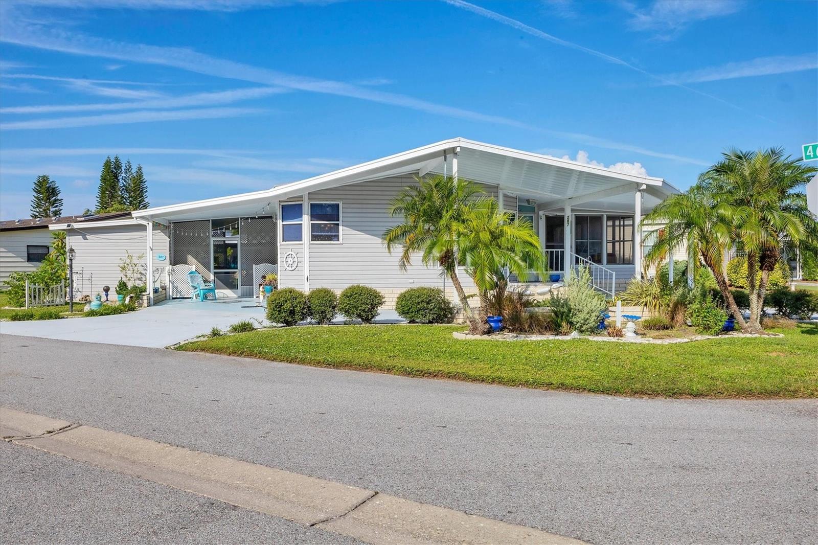 Welcome to your own little peace of paradise. This move in ready home is waiting for you to make it your own. With 1421 heated space and 2648 SQ Ft this beautiful home is large enough to fit any ones lifestyle. It features cathedral ceilings and a circular driveway This spacious house has a open floor plan. Shadow Brook is one of the best kept secrets in Manatee county. You own the land which means NO LOT RENT. The low quarterly fee includes Water, Sewer, Cable and Internet. It is a any age pet friendly park.This beautiful house Has recently had a new AC Unit ($7,148 New Ductwork $2250 Purchased 10 year coverage for AC unit $250 and Surge protector for the AC unit $1502. These were all installed in 2025. It has had all the waterlines replaced in 2016. The premier bedroom has had the floor replaced. It has had a lifetime vapor barrier installed. 10 hurricane straps have been added to the house. 2 anchors were added to the carport beams. A new dishwasher was installed in 2024. The washer and dryer and fridge plus a new wall oven were purchased in 2016 and 17. A Roof was installed in 2012. Recent Four-point shows at least 12 years of life left on the roof. Awning and storm panels have also been installed. It has a lot of cabinets with tons of space. Shadow Brook features a beautiful heated pool and shuffle board courts. The clubhouse has a large library and a pool table. You can rent out the clubhouse for special events. Shadow Brook is located near the Sunshine Skyway Bridge and I 75. The beautiful gulf beaches of Anna Maria Island are just a short drive away. All room sizes are approximate. Please use As Is contract.