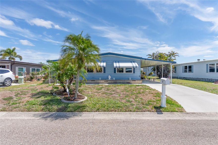 Ready to take it easy? Grab your pole and your bocce ball. This leisure-packed, 55+ Gated Community is waiting for you! With thoughtful amenities like a large community pool, spa, sauna, pickle ball, tennis, bocce ball, lawn bowling, horseshoe pit, dog park, shuffleboard, library, billiards, and more, you will never struggle to find your lane. Learn a new skill at the hobby/recreation rooms, go fishing in Snook Lake, slip your boat in at the community marina, or work on your golf game at the golf practice nets. Veterans enjoy support and friendship at regular meetings. And your home? What's not to love? Almost new roof, new windows, almost new stove and microwave. 2023 water heater, updated drywall, updated doors and trim, built-in dinette cabinetry, custom-built kitchen island, spacious lanai, covered front porch, clean landscaping, carport, storage, and more. Don't wait for the good life, it's right here!