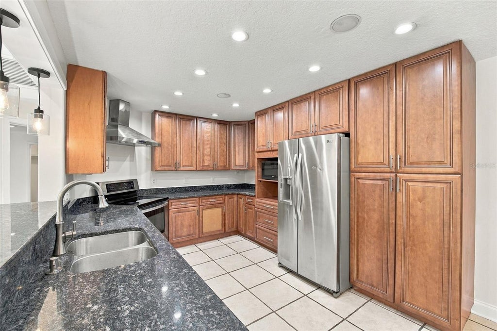 Photo of 7958 Glen Abbey Circle, Orlando, FL 32819 (MLS # O6453043)