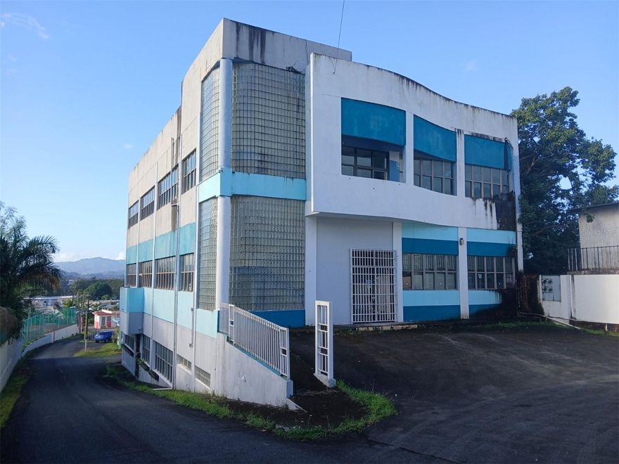 This property is a 10,656 square foot 3 story commercial building on a quarter acre lot in Guaynabo, Puerto Rico. The property is located on route 2 just 40 feet East of the Guaynabo/Bayamon border, a very highly traveled area that is an excellent location for commercial businesses. 
The building is structurally sound, well built, is currently empty, needs cleaning, remodel, and repairs with the most recent occupancy in 2024.  An elevator and stairs in the building allows access between the floors with the elevator in need of repair. The property has 20 parking spaces and a Rooftop Cell Site that is separately owned.
Each floor of the building is over 3300 square feet with flexible space design making it easy to accommodate, build and set up space for all different categories of tenants. The building can accommodate a huge array of businesses including, but not limited to, professional offices, medical clinics, retail locations, learning centers, food service, light manufacturing, churches, and more.  :

For the design of the building each floor of the three floors of the building has a center hallway going approximately 70 feet from the North side to the South side of the building. The elevator, main stairwell and entrance foyers are on the North side of each floor. The womens and mens public restrooms, an emergency exit, and emergency fire equipment are at the South end of the North/South hallway on each floor. The flex design can be applied to the East and West side of each floors' North/South hallway and with the flex design the floor configurations can be adjusted to a Buyer's and rental tenants' desires. With the current configuration the building has 4 different reception areas, 9 bullpen/conference room/assembly areas and 20 offices distributed among the floors. The current configuration could comfortably accommodate 14 different businesses but as mentioned this configuration can be changed to accommodate more or less businesses.

The building also has a rooftop terrace that can be accessed from the top of the main stairwell at the North side of the building. The roof has a railing around the entire rooftop for safety and has views over the Bayamon/Guaynabo area to the hills of Puerto Rico. There is also a separately owned rooftop cell site and a storage room on the roof.
The Guaynabo/Bayamon area where the building is located is one of the premier areas of Puerto Rico. Nestled in the heart of the San Juan metropolitan area, the area offers upscale suburban comfort, strategic location, and vibrant culture of Puerto Rico. Known for a high quality of life, top-rated bilingual schools, and secure neighborhoods, the Guaynabo/Bayamon area is one of the most sought-after residential and investment destinations on the island of Puerto Rico. The area boasts first-class amenities including luxury shopping centers, gourmet restaurants, boutique fitness studios, and exclusive country clubs. The area is also home to numerous health and wellness centers, including state-of-the-art hospitals and private clinics. All these amenities are less than 15 minutes from the property with some being within blocks of the property. 
For travel and commerce the property is close to air and ocean ports being just 3 1/2 miles from the Puerto Nuevo ocean ports, 5 miles from Isla Grande Airport and 10 miles from the San Juan International airport.
The property is an ideal property in an ideal location to house many different diverse businesses.
