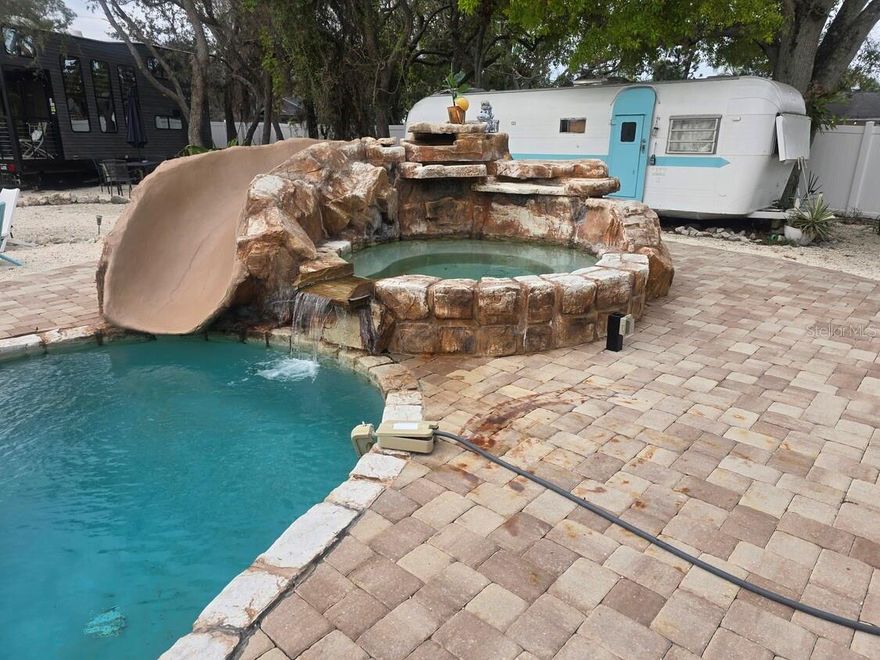 Welcome to this unique and well-established short-term-rental (STR) opportunity in the heart of Bradenton,  This exceptional property features a total of 7 bedrooms and 14 beds available offering diverse accommodations that include a charming 3,133 square foot, 3-bedroom, 2-bath main house, a spacious apartment above the 3-car garage, 2 cozy tiny houses and the ever popular 1971 Airstream trailer. With consistent occupancy above 80% and stellar reviews, this turn-key investment is ideal for continued STR operation or as a residence where the owner lives on site and manages the rentals. The on-site amenities include the sparkling pool , relaxing rec area, and close to all services. Financials available with NDA.