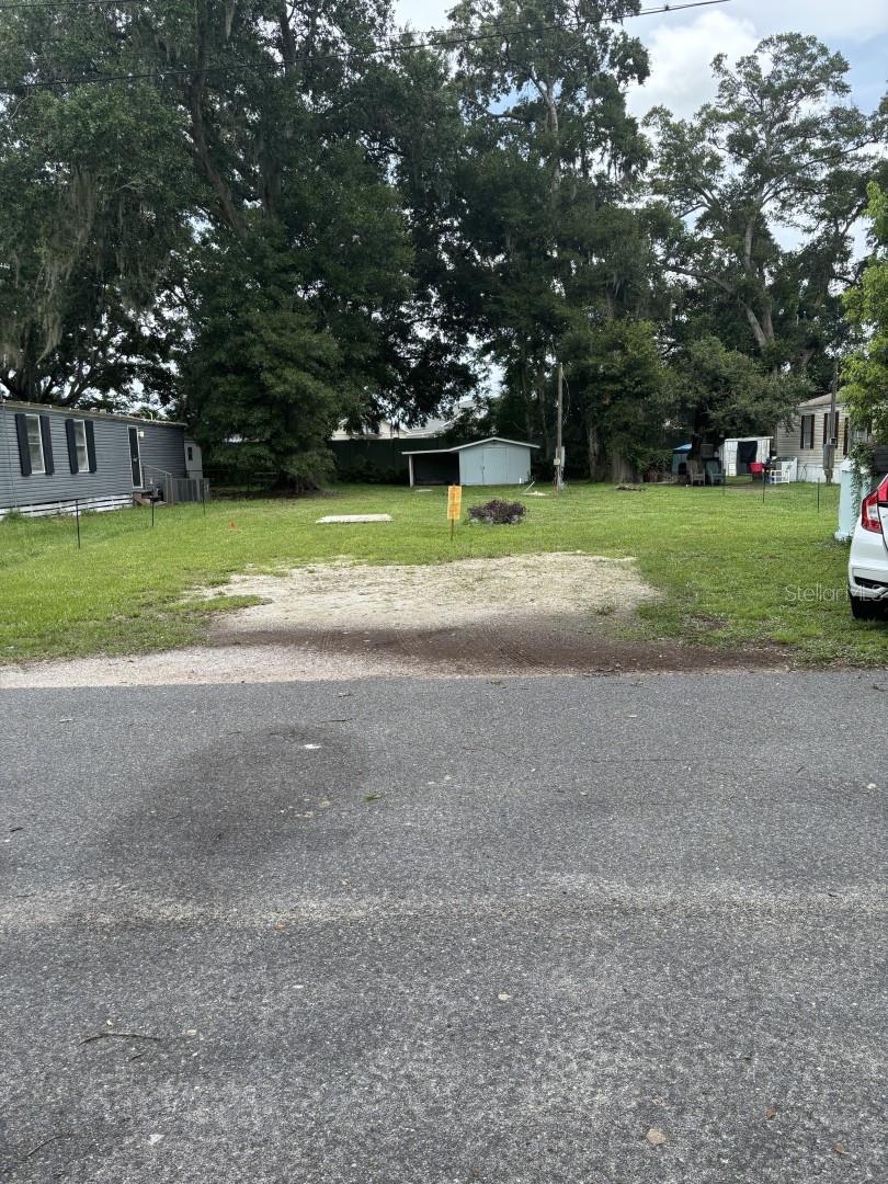 This property at 6379 Co Rd 154A in Wildwood, FL and is categorized as a Land/Lot type home. this property offers a total finished area of feet. The property does not have any stories in its structure, presenting a single level layout for potential development. Situated on a spacious lot size of 6,366 square feet, this property provides ample space for various outdoor activities and landscaping opportunities. The property's construction in 1982 reflects a durable and established foundation, offering a sense of longevity and reliability for any future developments or improvements. The Land/Lot type home designation provides flexibility for potential buyers or investors to customize the property according to their preferences and needs. With no defined stories, the property allows for a blank canvas for creative architectural designs or landscaping projects. The 72 square feet of finished area provides a starting point for potential expansions or renovations, allowing for various possibilities to enhance the property's overall value and functionality. The absence of bathrooms or half bathrooms offers an opportunity for customization based on specific requirements or preferences, enabling potential buyers to tailor the property to their unique needs. The generous lot size of 6,366 square feet presents a rare opportunity for outdoor enthusiasts or individuals seeking a spacious property for recreational activities or gardening projects. The sizeable lot provides ample space for outdoor entertainment areas, gardening plots, or additional structures, offering a versatile canvas for creative landscaping designs or expansion projects.In summary, this property at 6379 Co Rd 154A in Wildwood, FL offers a unique opportunity for potential buyers or investors looking to customize a Land/Lot type home to their specific preferences and needs. With a construction date of 1982, a finished area of 72 square feet, and a lot size of 6,366 square feet, this property presents a solid foundation for future developments, renovations, or customizations, making it an attractive option for those seeking a versatile and spacious property in a desirable location. **land with well, electricity and shed. 125' x51'lot, the Villages homes behind, vacant land. **NO SELLER FINANCING - 60K FIRM. VACANT LAND, NO 2 BEDROOMS, NO INTERIOR LIVING SPACE, MOBILE HOME REMOVED, SURVEYED LOT 125' X 51', PLEASE GO BY AND VIEW. NO 1982-NO SHOWING TIMES-GO ANYTIME-VACANT LAND