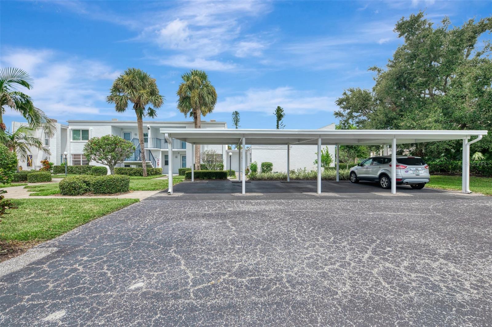 Attractive two bedroom, two bath, second floor condo, in the small, private community of Capri Village East. Your condo features vaulted ceilings in the combination dining room, living room area, with rear North exposure, that make it light, bright and open and airy. Sliders from the living room to your private lanai. Split bedroom floor plan, with a walk-in closet in the master bedroom, as well as the second bedroom. The second bedroom bath, has a newer remodeled shower stall and both bathrooms have newer vanities. Double pane windows were installed about 6 years ago. The roof of the building was just replaced in early 2025. The water heater was replaced in 2024 and the AC system in 2019. Capri Village East has just 24 properties and offers a community heated pool and clubhouse. This is a great location just off of popular Capri Isles Blvd., and right next to Capri Isles Golf Club and Waterford Golf Club is just up the street. Beautiful downtown Venice and the beaches on the Gulf of America are just a few miles away. Come see this greay buy today!