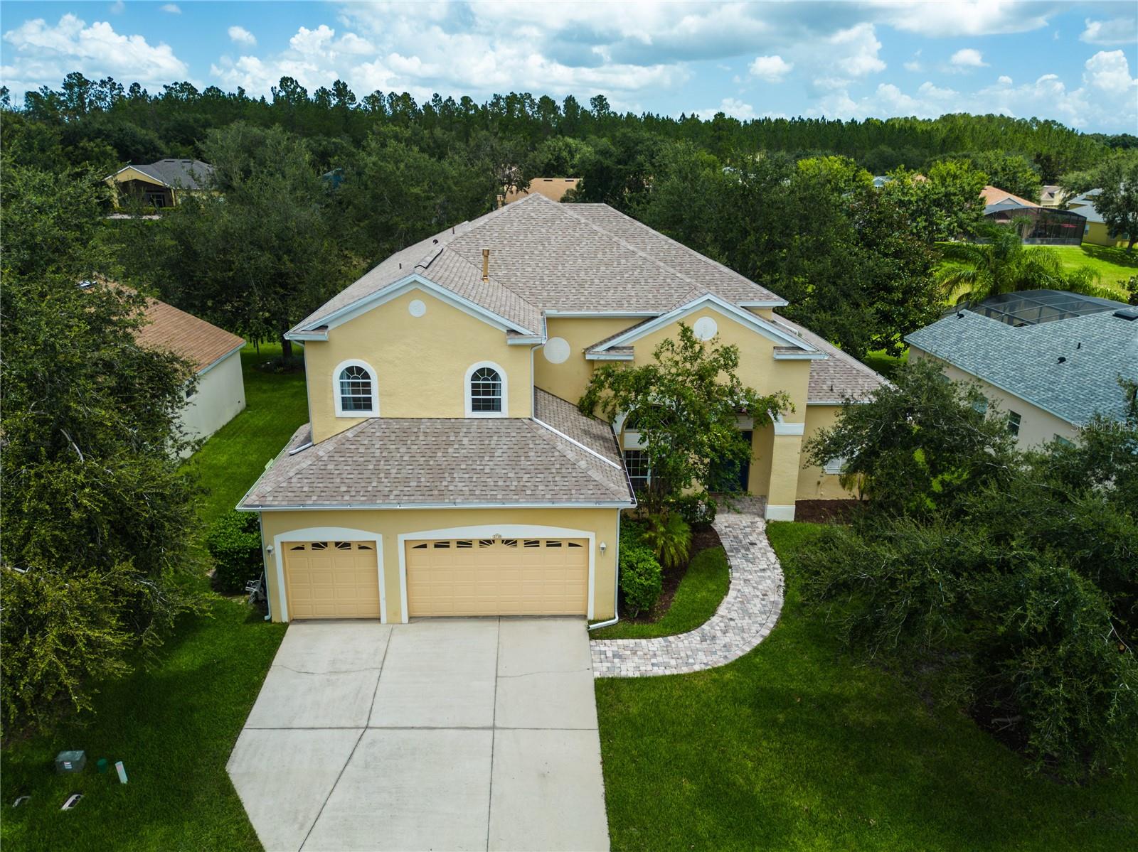 Welcome to refined living in the Gated Community Nestled in the highly sought-after Regency Hills community of Clermont, this spacious 5 bedroom, 4 full bath estate offers over 4,800 square feet of luxurious living space on two beautifully designed levels. Built in 2005 and thoughtfully maintained, this home features a timeless and spacious gourmet kitchen with an oversized walk-in pantry, a new roof (Aug 2022) and two brand-new A/C units installed in May 2025, providing peace of mind and energy efficiency for years to come. Let's talk about the pristine neighborhood, all the houses are all well maintained as well as the streets, it’s a must see!
As you step inside, you’re greeted by ceramic tile flooring throughout the main living areas, while cozy carpet adds warmth in all the bedrooms. The open concept layout is ideal for both everyday living and entertaining, enhanced by pre-wired surround sound on both floors. Whether you’re hosting guests or enjoying a quiet night in, this home is wired for sound, comfort, and connection.
Upstairs, a private balcony offers serene views of the lush, professionally trimmed mature trees in the backyard, creating the perfect retreat for morning coffee or evening sunsets.
Car enthusiasts and hobbyists will appreciate the spacious 3-car garage, while outdoor entertainers will love the pre-plumbed gas line ready for a future outdoor kitchen or custom pool design, did I mention there is an existing pool bath entry already?
This home truly has it all…space, upgrades, and style all within a secure, gated community with top-rated amenities such as Tennis, Pickleball, Basketball Courts, a Playground and a well kept community pool.